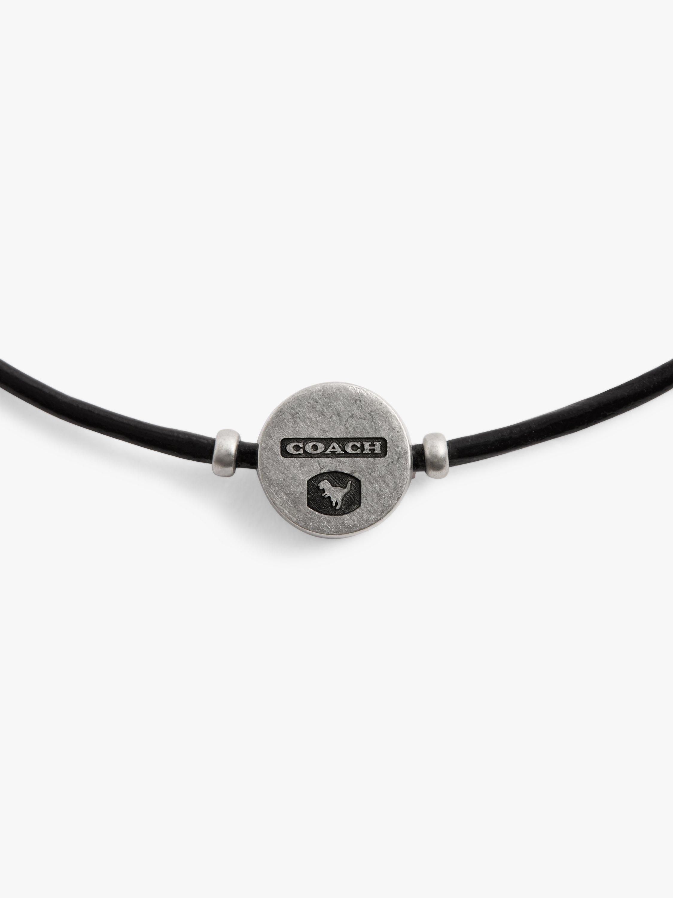 Product image 3 of 3, which shows Coach Unisex Rexy Logo Leather Slider Bracelet, Black