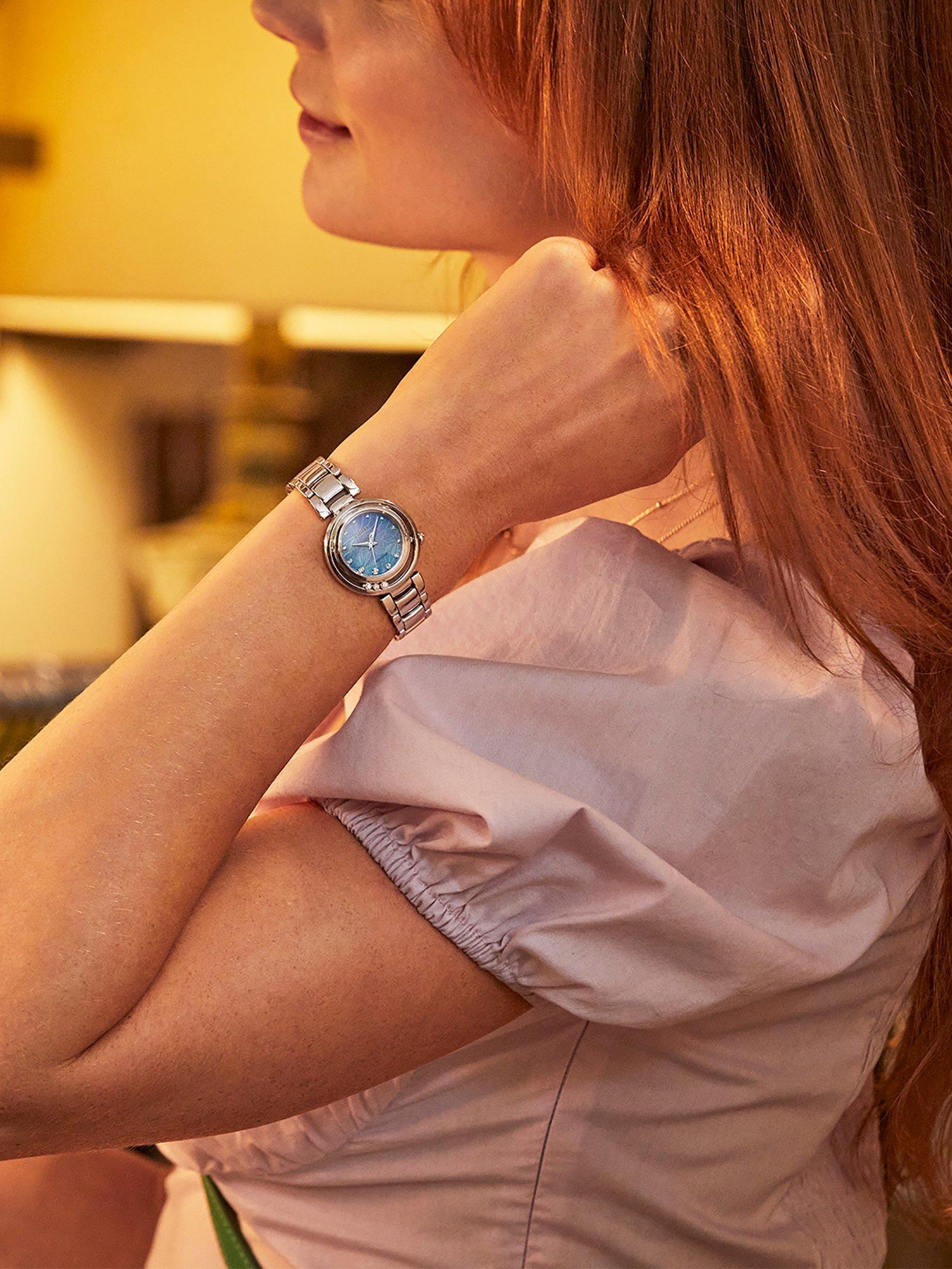 Product image 5 of 8, which shows Citizen EM1110-81N Women's L Arcly Diamond Eco-Drive Bracelet Strap Watch, Silver/Blue