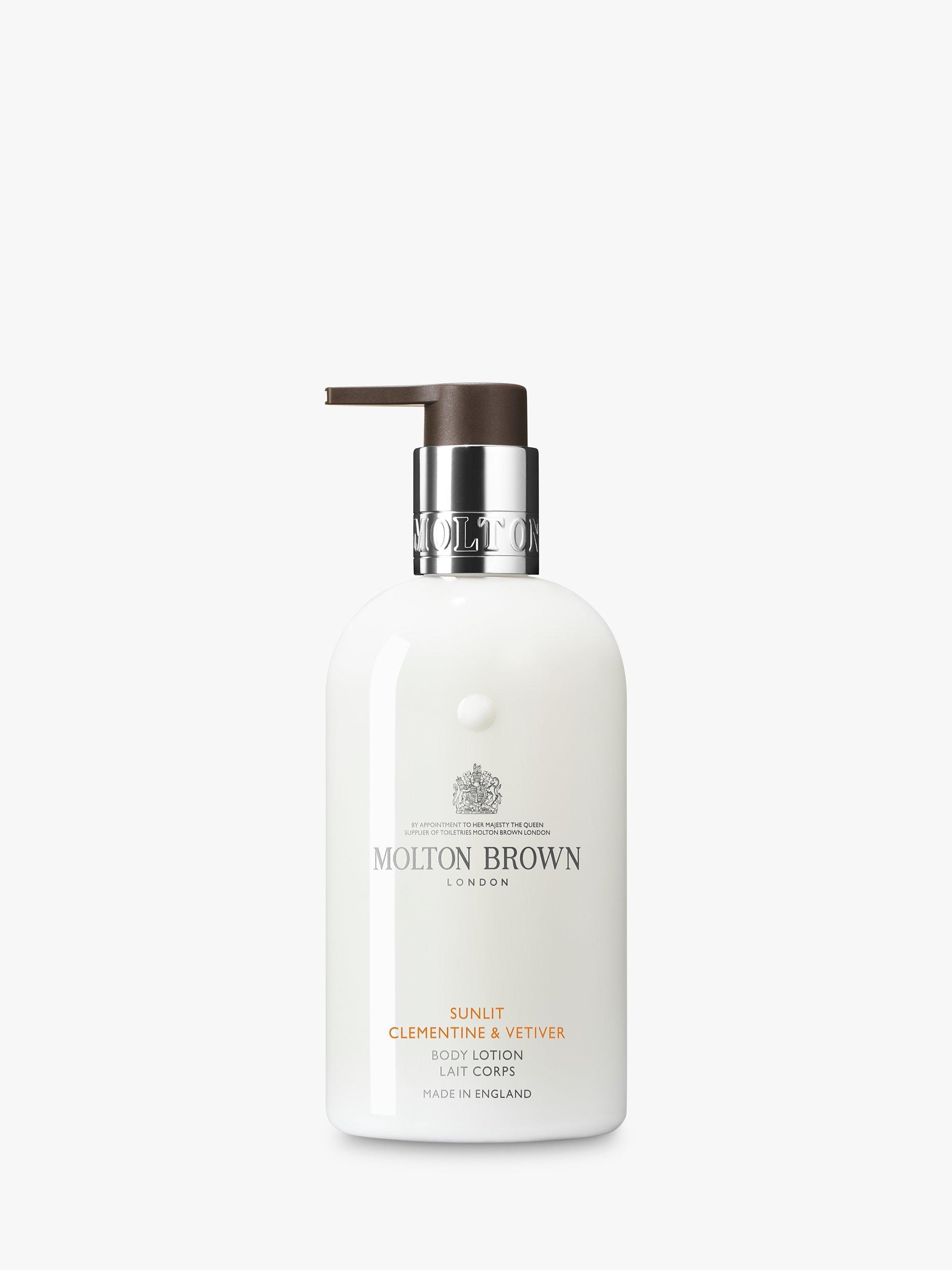 Product image 1 of 2, which shows Molton Brown Sunlit Clementine & Vetiver Body Lotion, 300ml