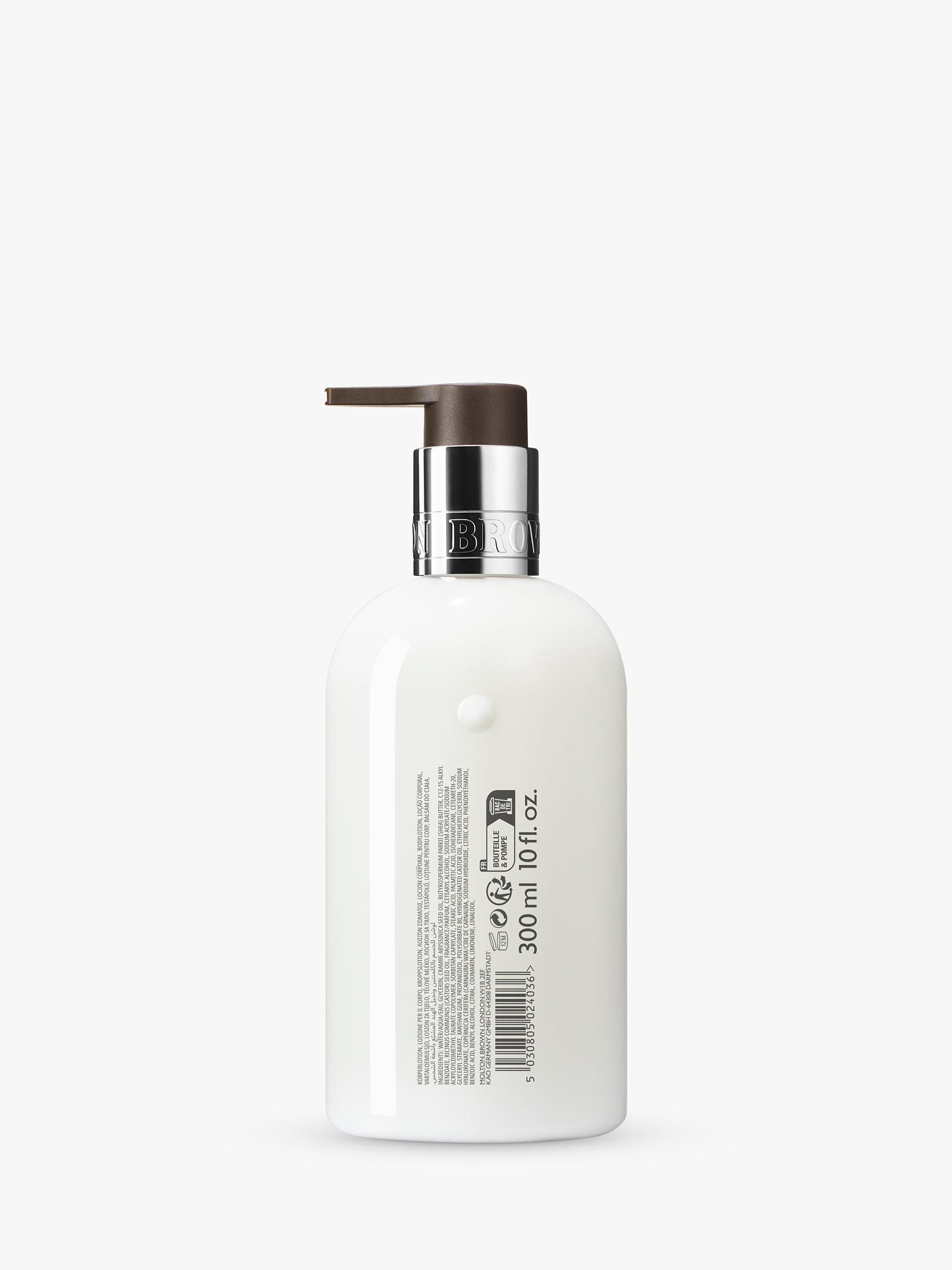 Product image 2 of 2, which shows Molton Brown Sunlit Clementine & Vetiver Body Lotion, 300ml