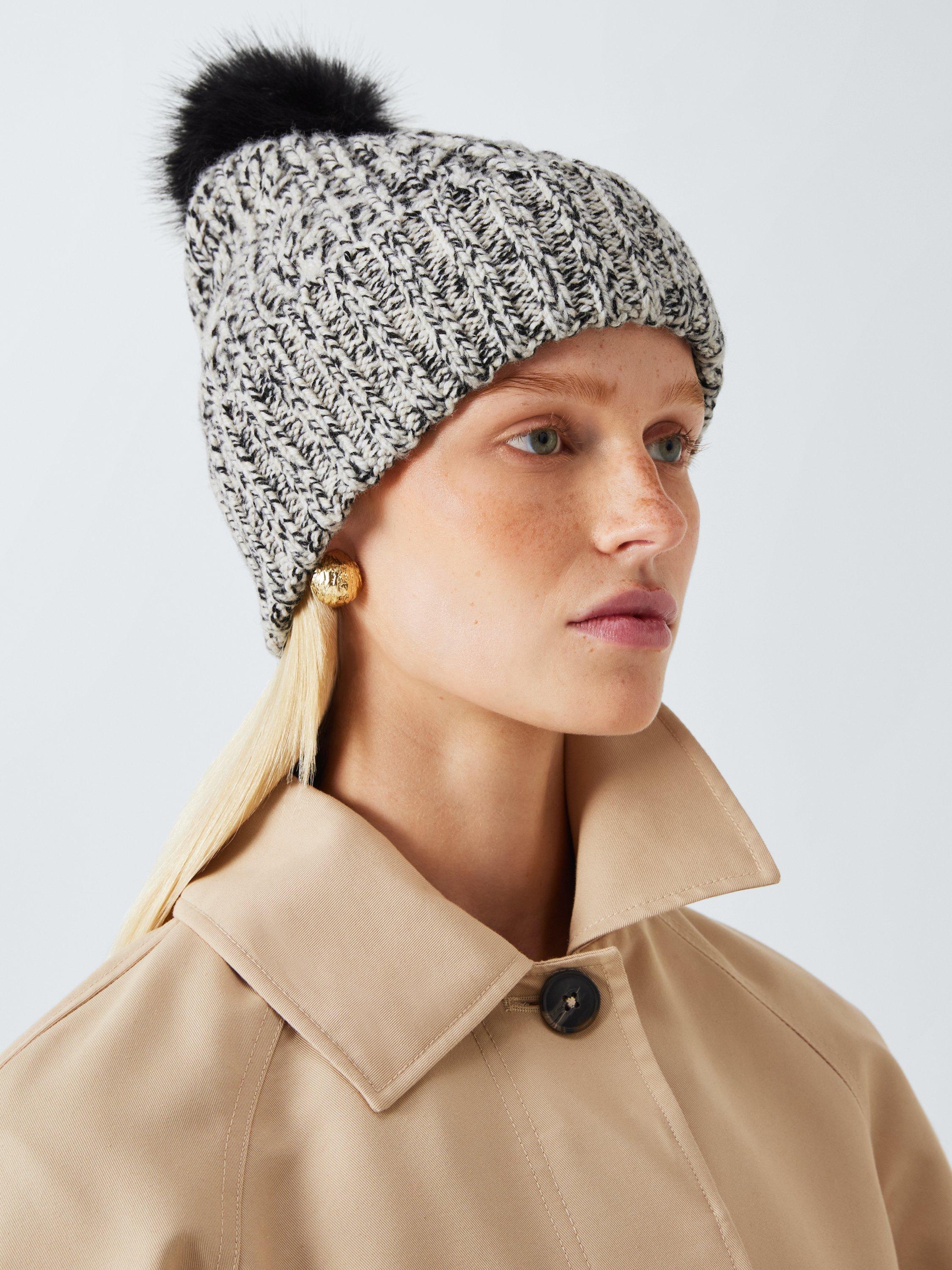 Cream hat with fur pom pom online