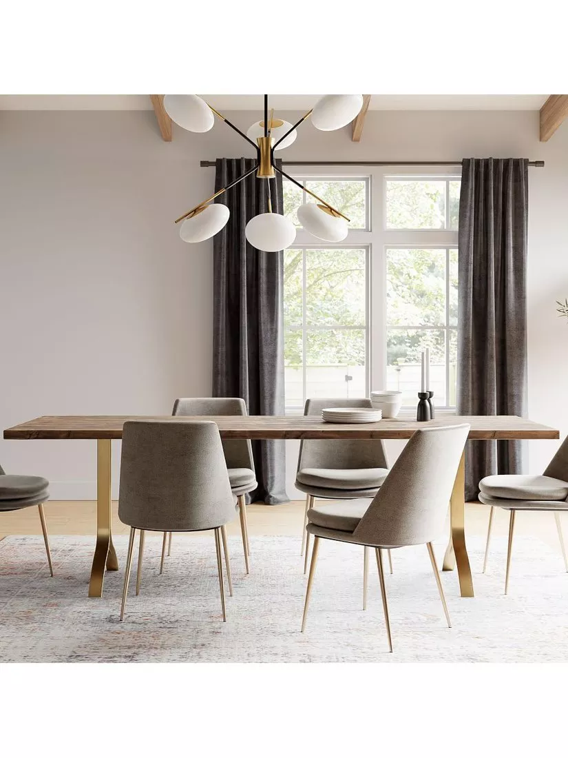 Dining room with a wooden table and beige chairs with gold legs