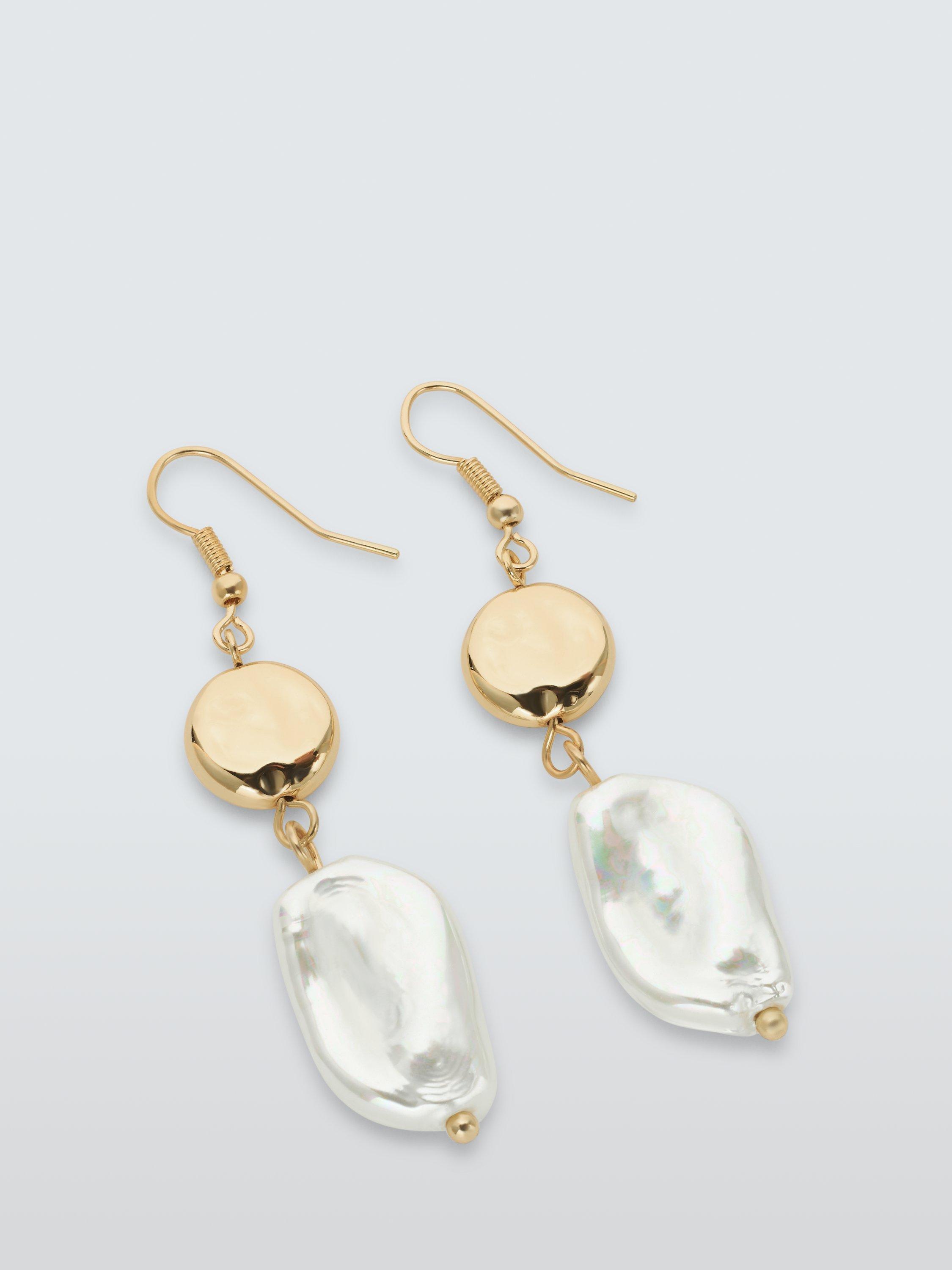 Earrings with glossy white porcelain disc with gold offers decorations