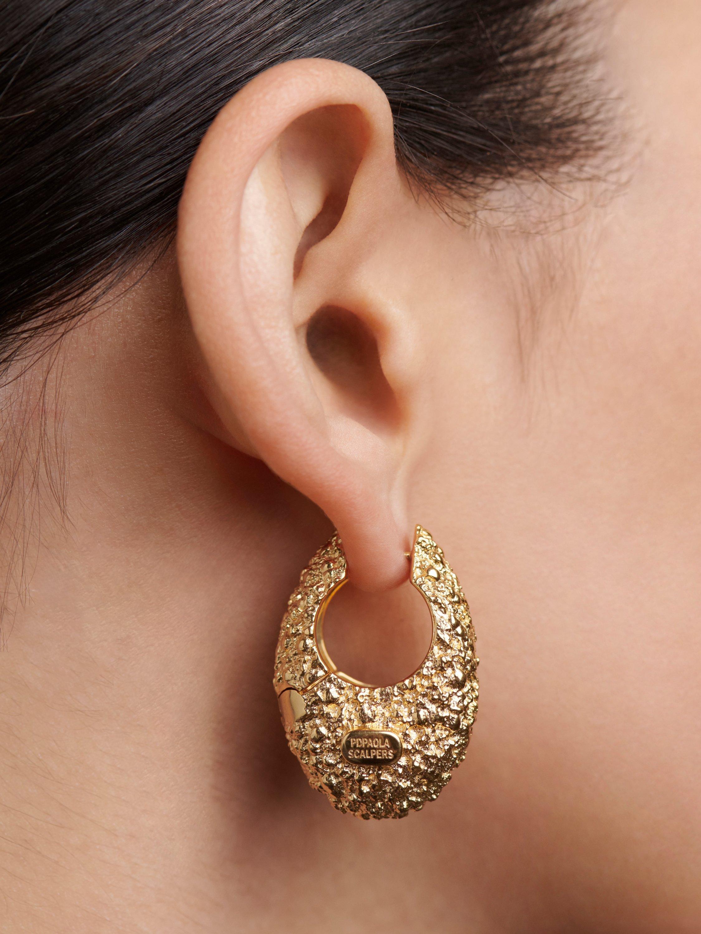 Product image 4 of 5, which shows PDPAOLA Chunky Molten Textured Hoop Earrings, Yellow Gold