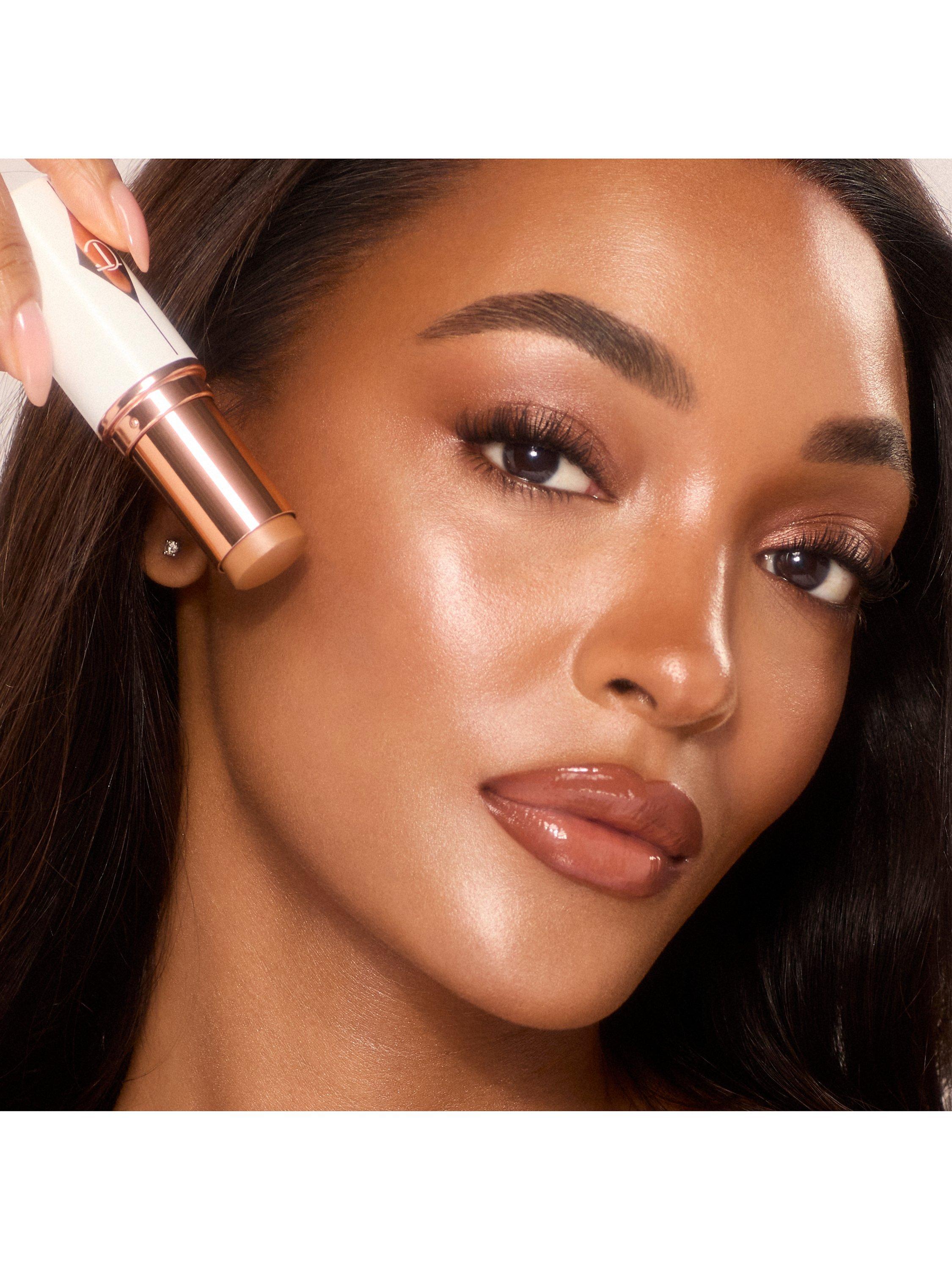 Product image 5 of 7, which shows Charlotte Tilbury Unreal Skin Foundation Stick, 10 Tan