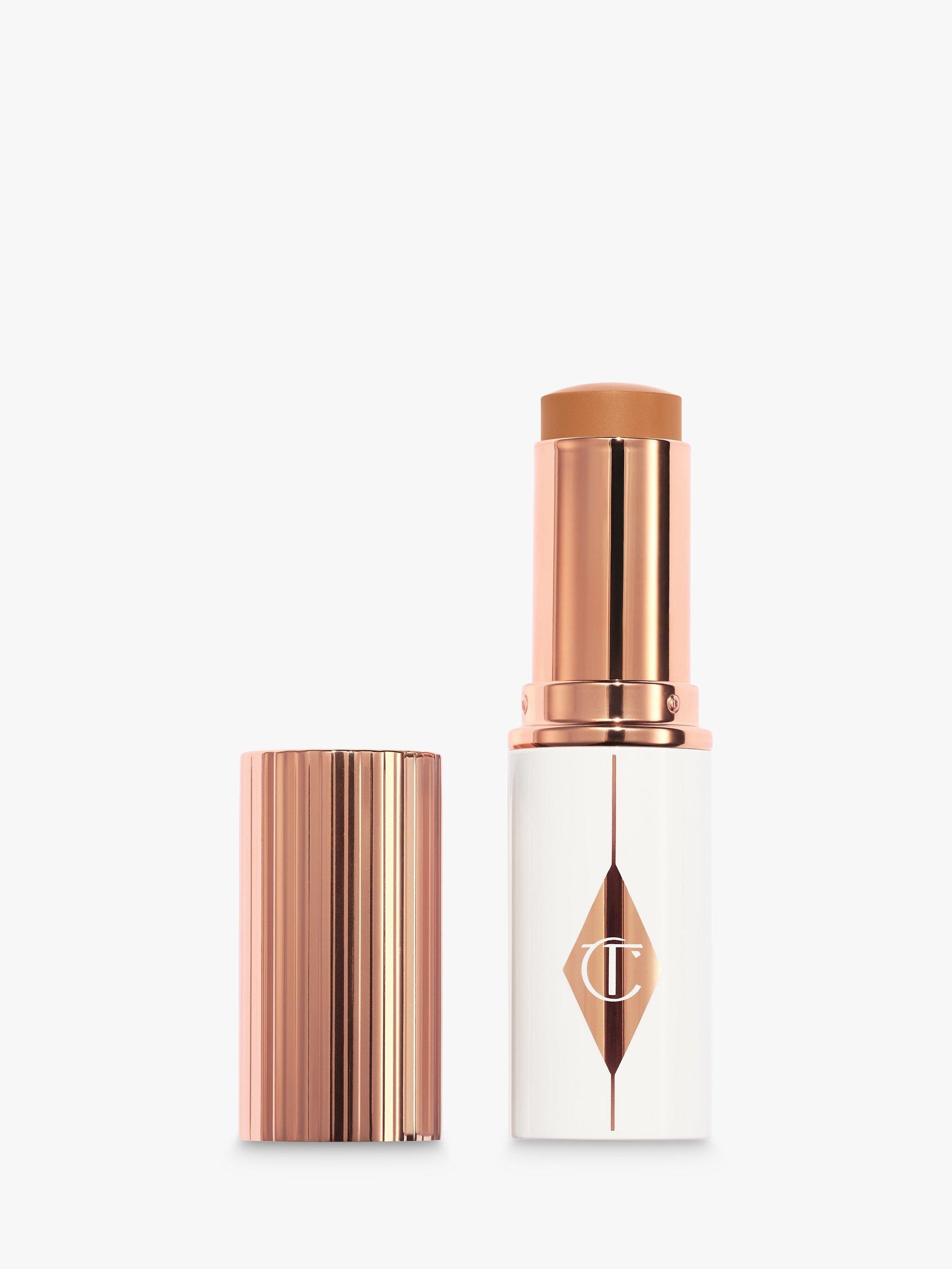 Product image 1 of 7, which shows Charlotte Tilbury Unreal Skin Foundation Stick, 11 Tan