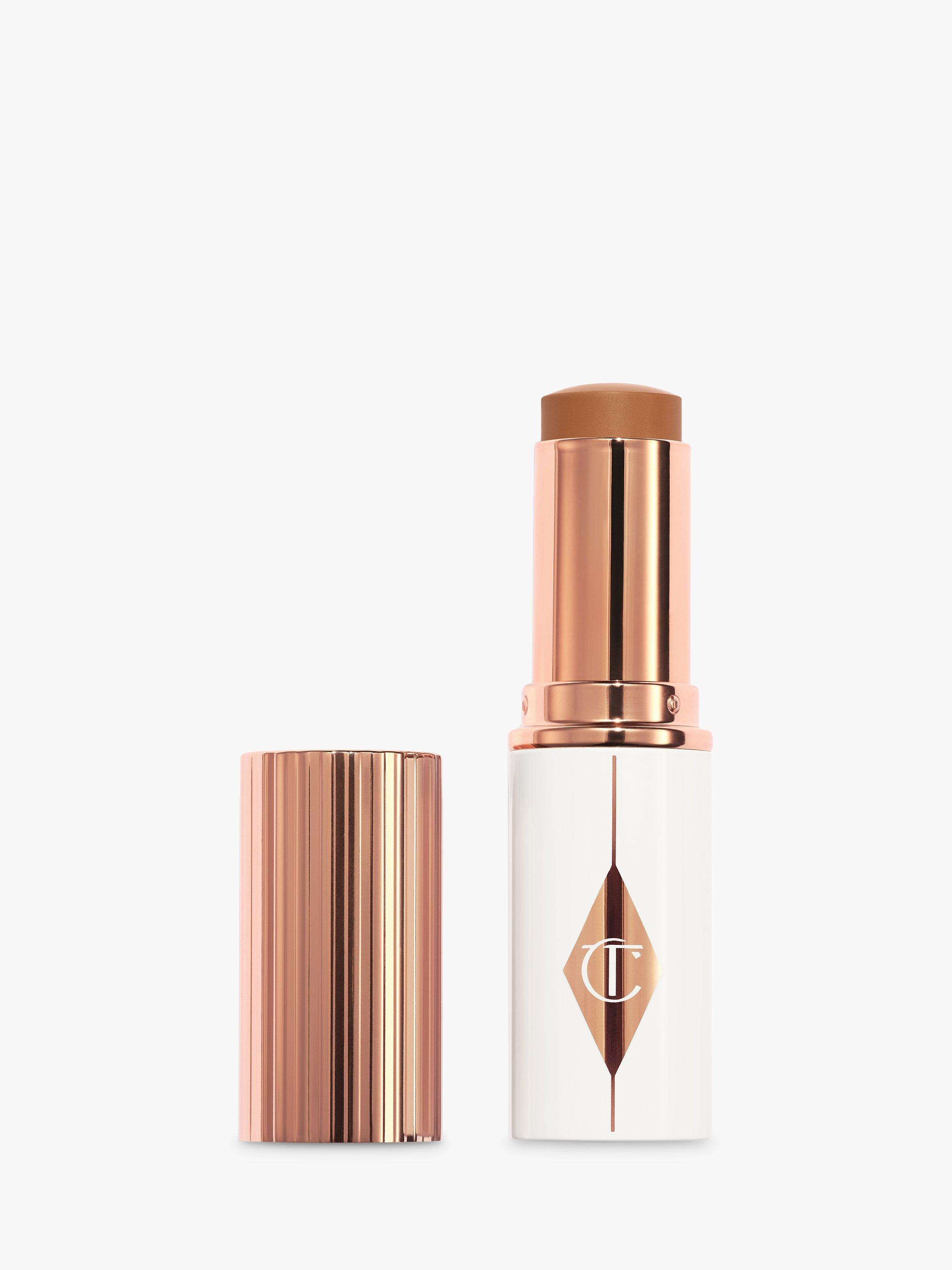 Product image 1 of 7, which shows Charlotte Tilbury Unreal Skin Foundation Stick, 12.5 Tan