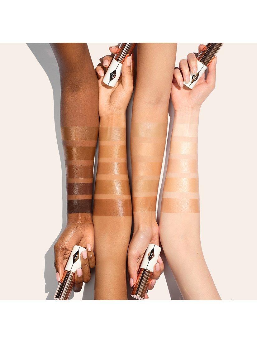 Product image 6 of 7, which shows Charlotte Tilbury Unreal Skin Foundation Stick, 12.5 Tan
