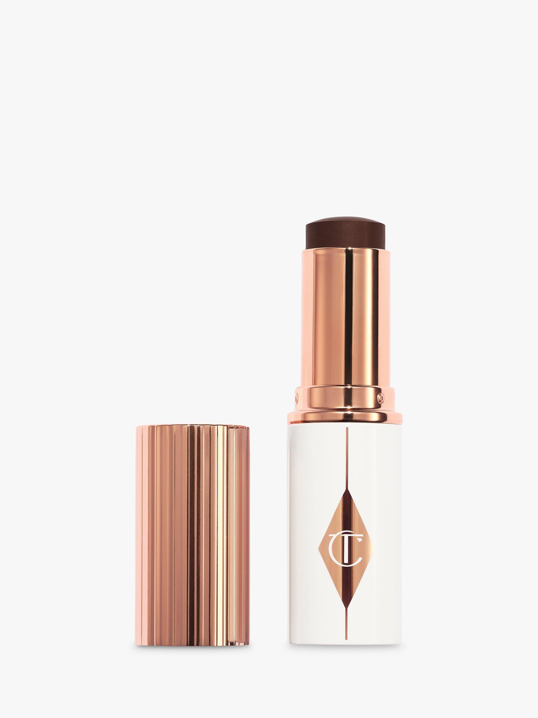 Product image 1 of 7, which shows Charlotte Tilbury Unreal Skin Foundation Stick, 17 Deep