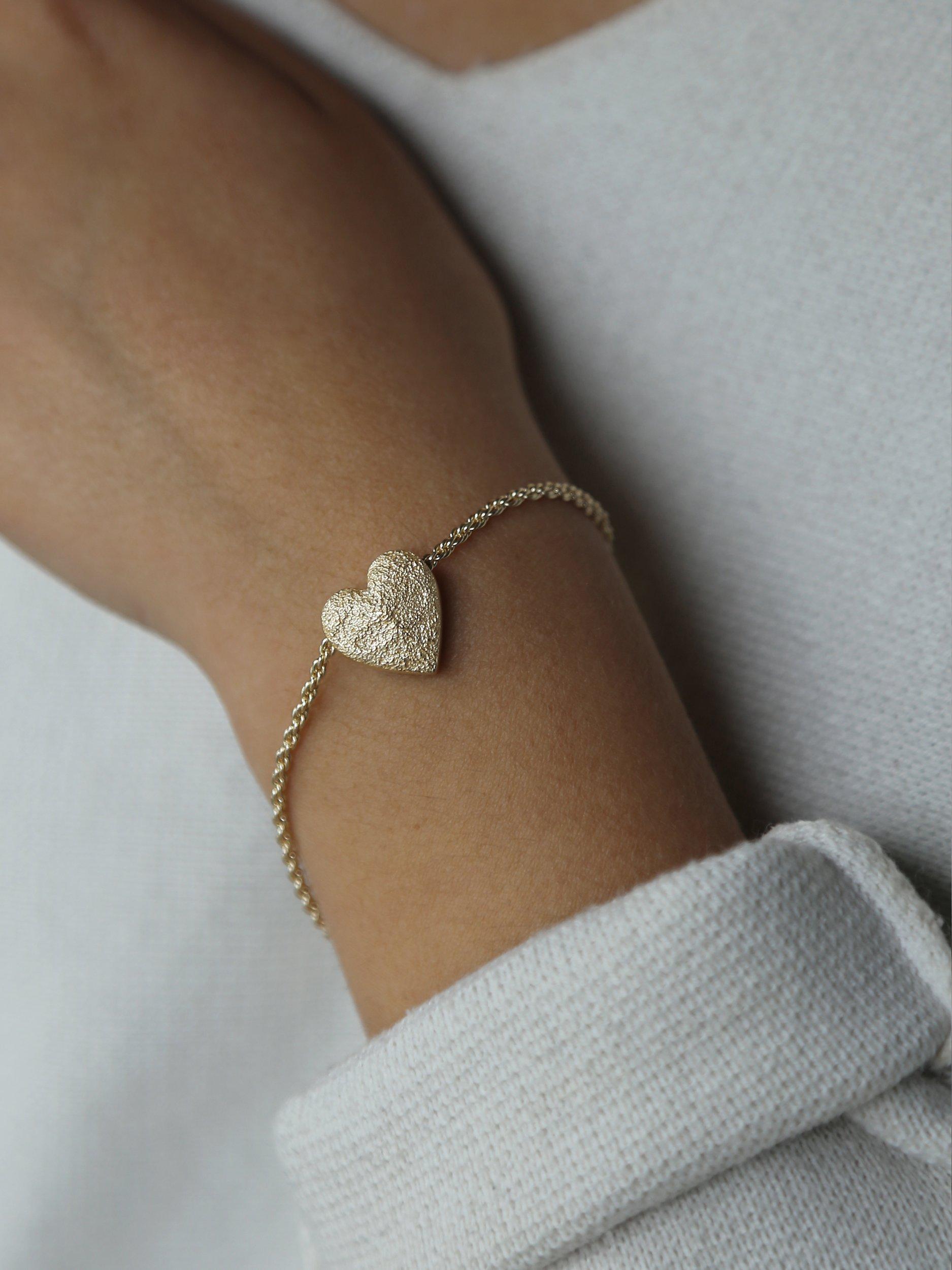 Product image 2 of 6, which shows Tutti & Co Embrace Textured Heart Chain Bracelet, Gold