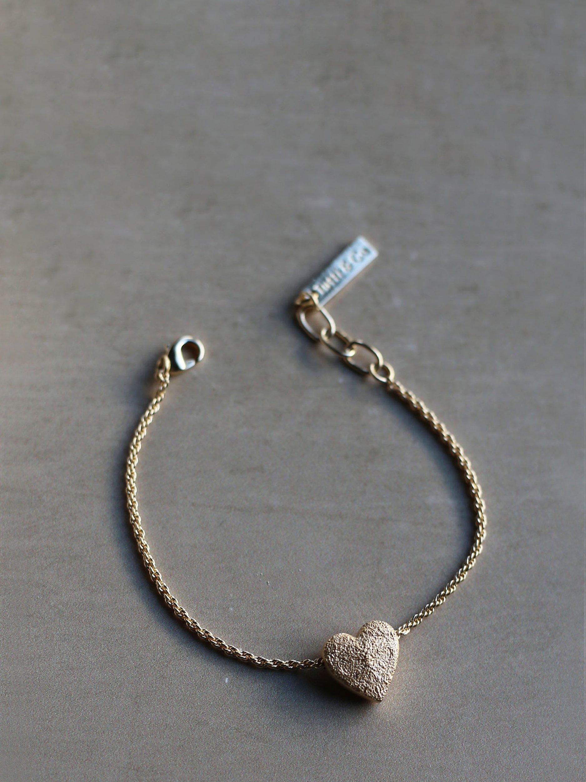 Product image 3 of 6, which shows Tutti & Co Embrace Textured Heart Chain Bracelet, Gold