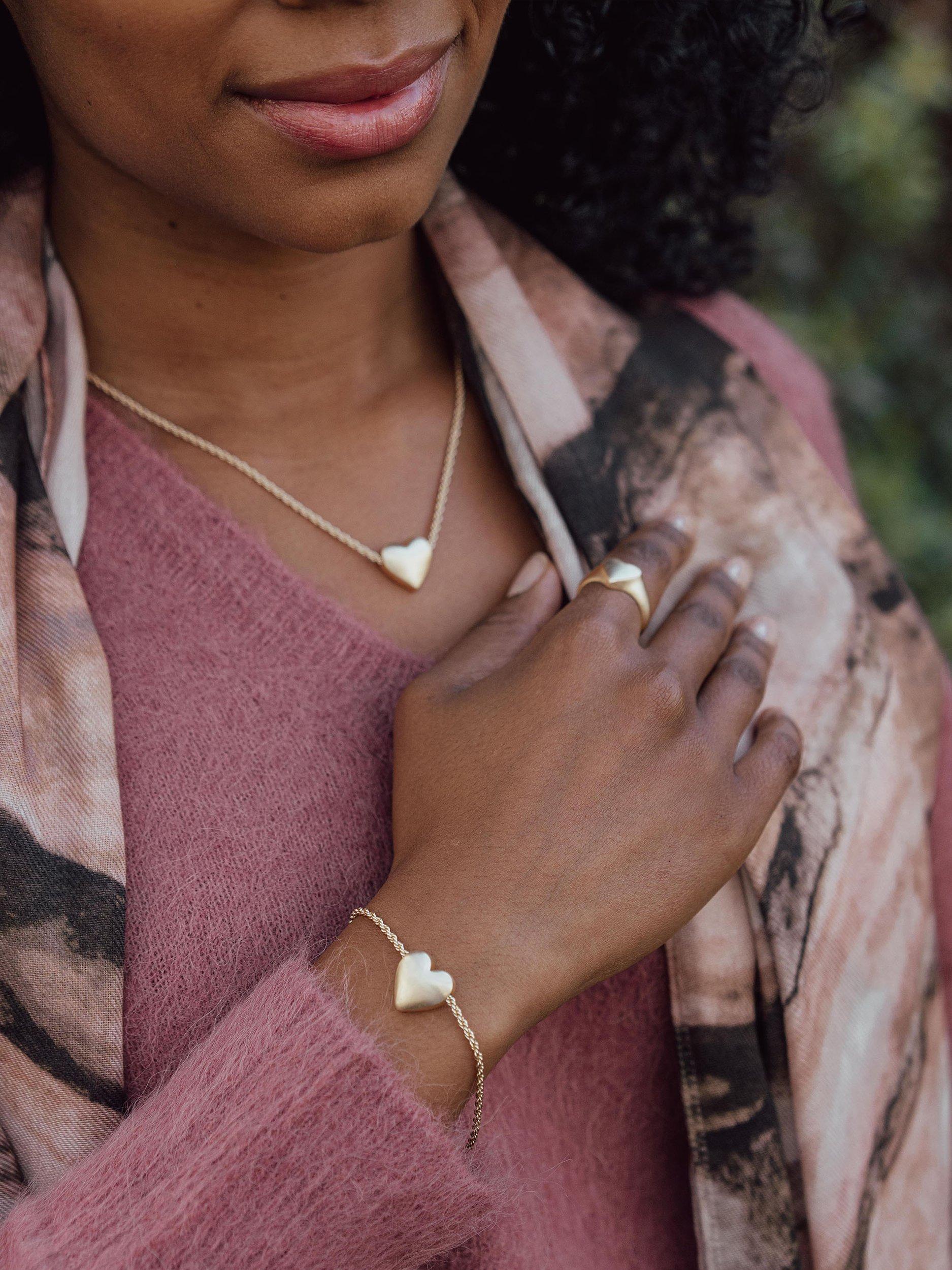 Product image 4 of 6, which shows Tutti & Co Embrace Textured Heart Chain Bracelet, Gold