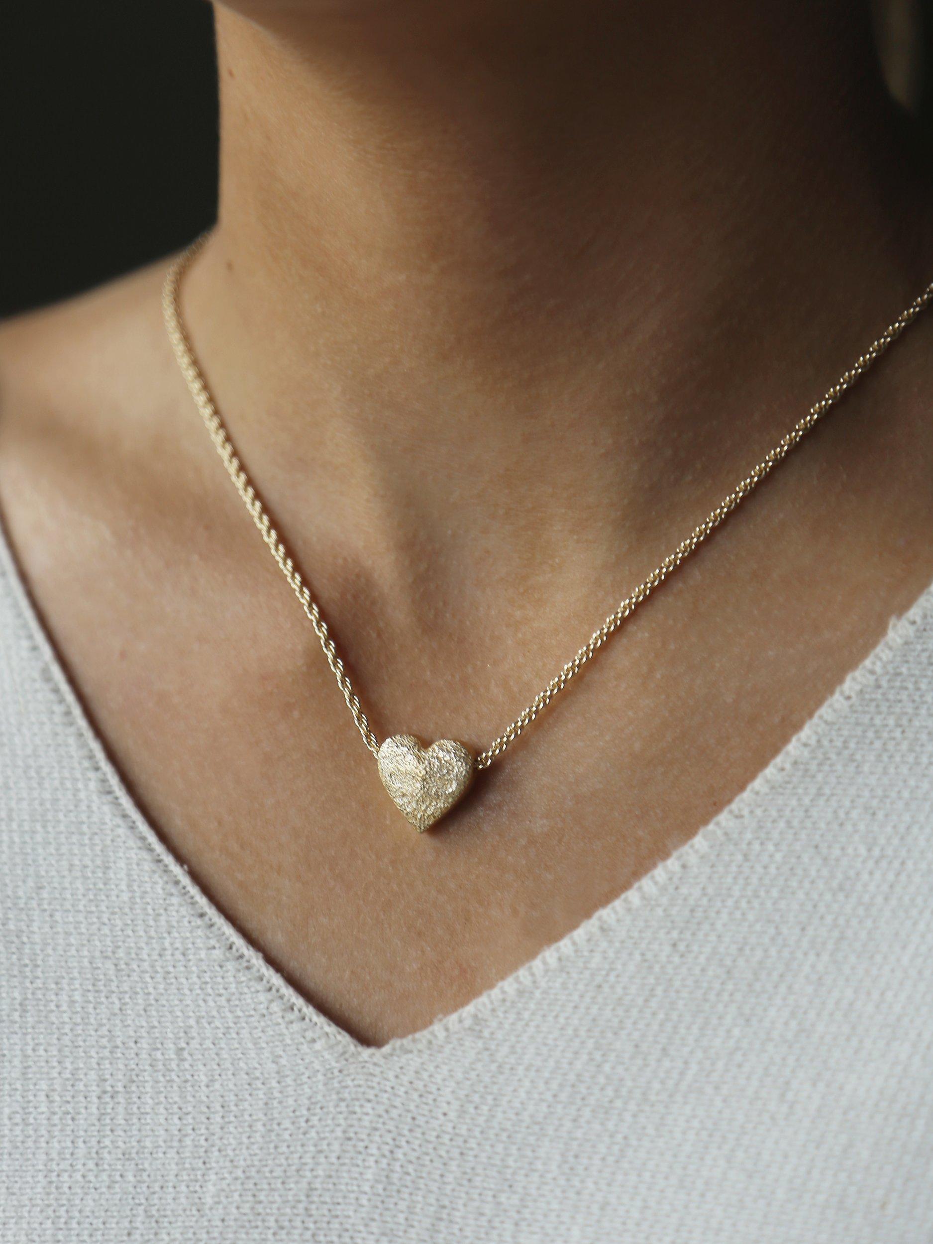 Product image 2 of 6, which shows Tutti & Co Embrace Textured Heart Chain Necklace, Gold