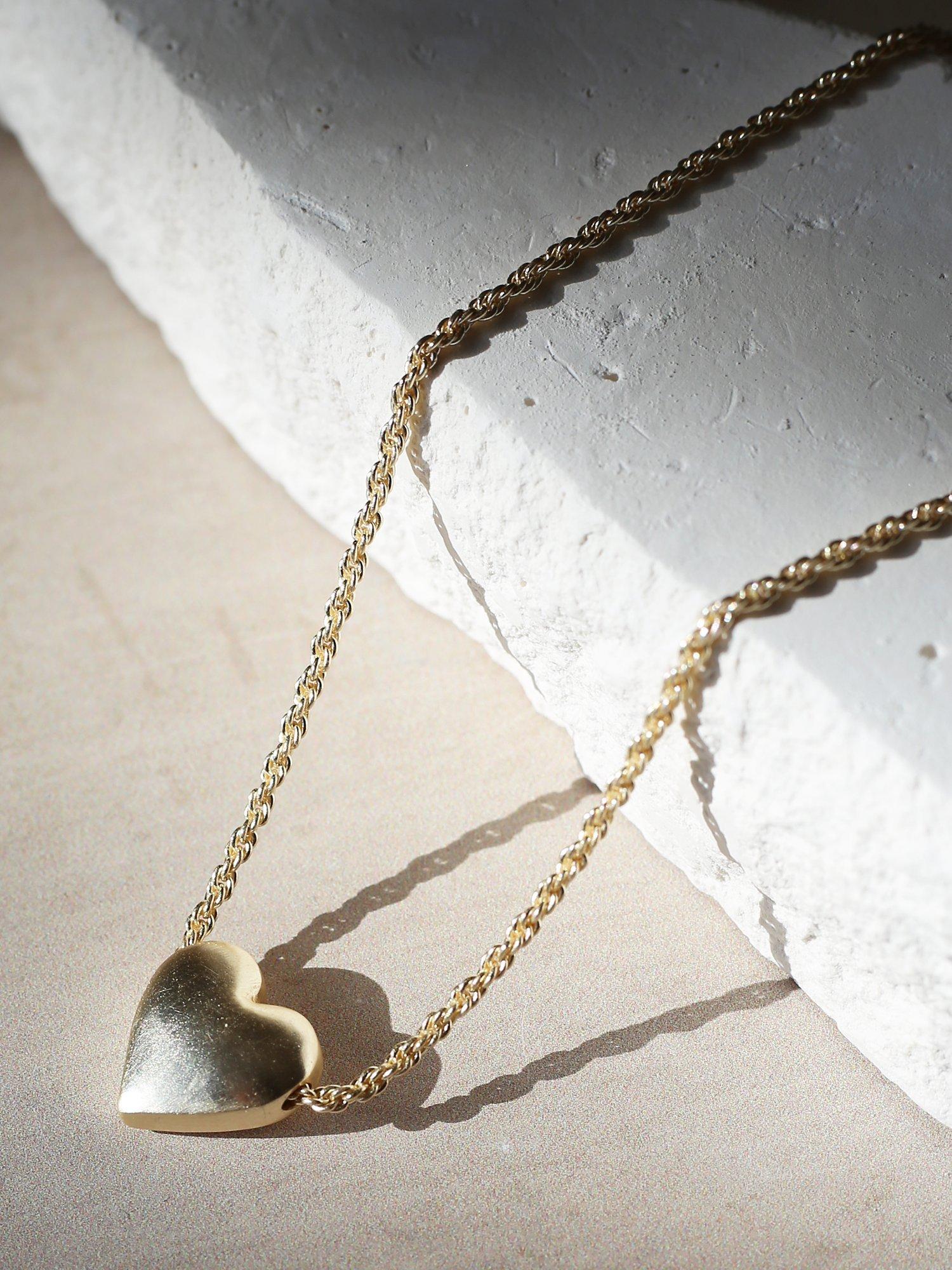 Product image 4 of 6, which shows Tutti & Co Embrace Textured Heart Chain Necklace, Gold