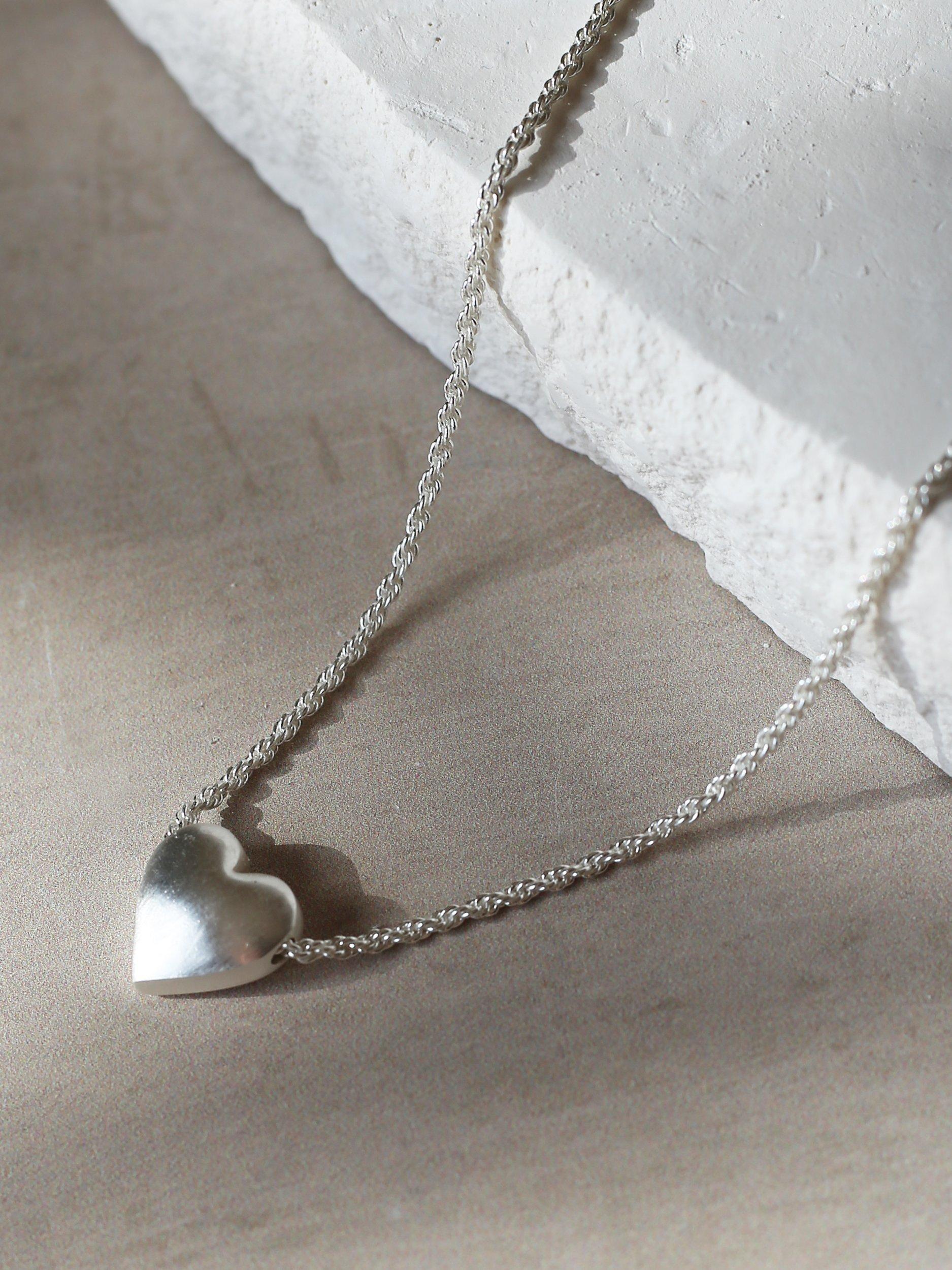 Product image 3 of 5, which shows Tutti & Co Embrace Textured Heart Chain Necklace, Silver