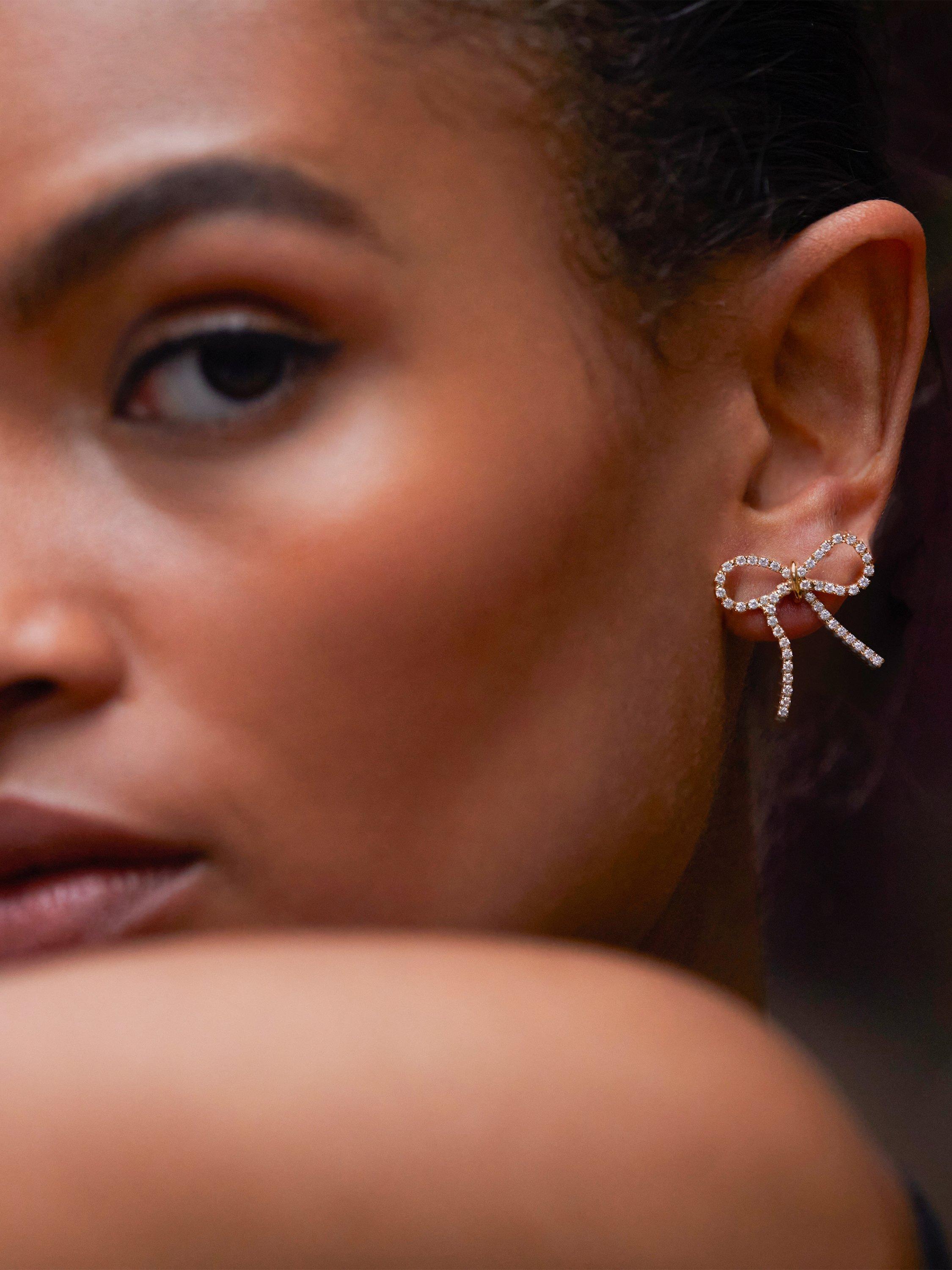 Product image 2 of 3, which shows Estella Bartlett Cubic Zirconia Bow Stud Earrings, Gold