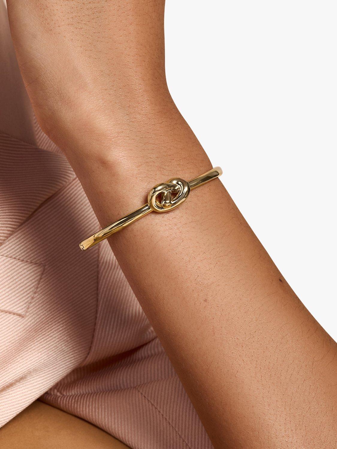 Product image 3 of 5, which shows Olivia Burton Lovers Knot Bangle, Gold
