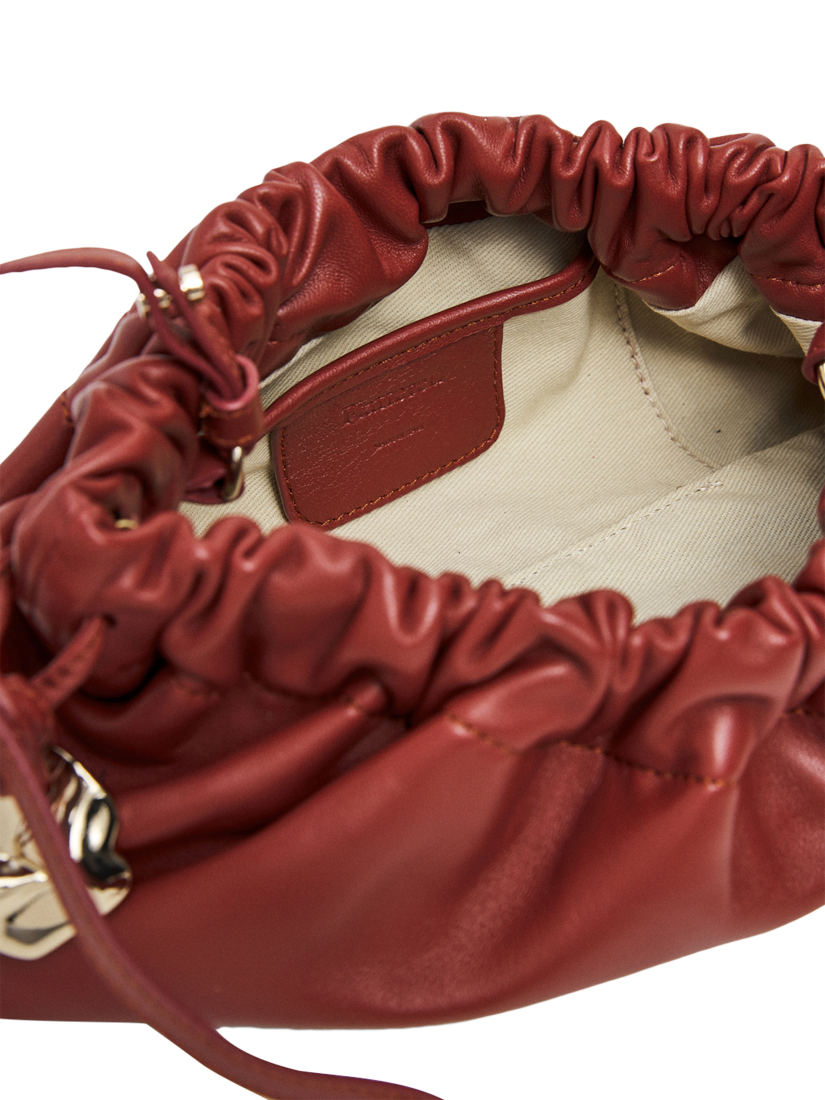 Product image 2 of 6, which shows Flattered Cissi Leather Ruched Clutch Bag, Brick