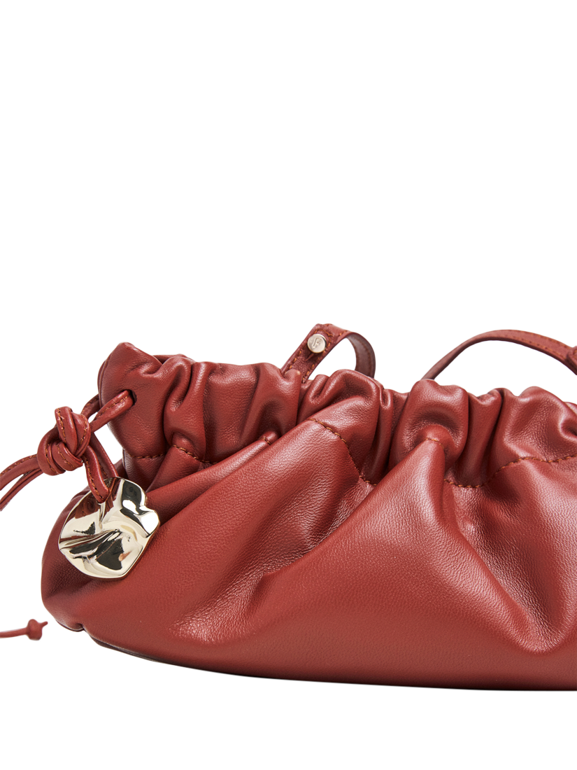 Product image 4 of 6, which shows Flattered Cissi Leather Ruched Clutch Bag, Brick