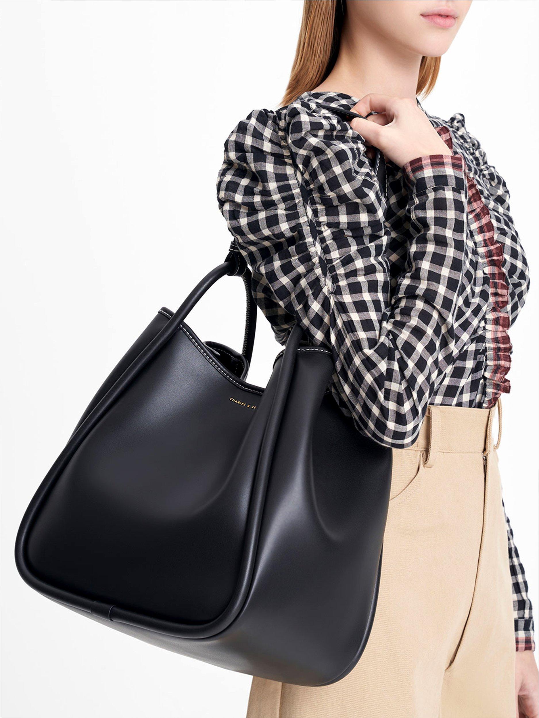 Product image 7 of 7, which shows CHARLES & KEITH Tubular Slouchy Faux Leather Tote Bag, Black