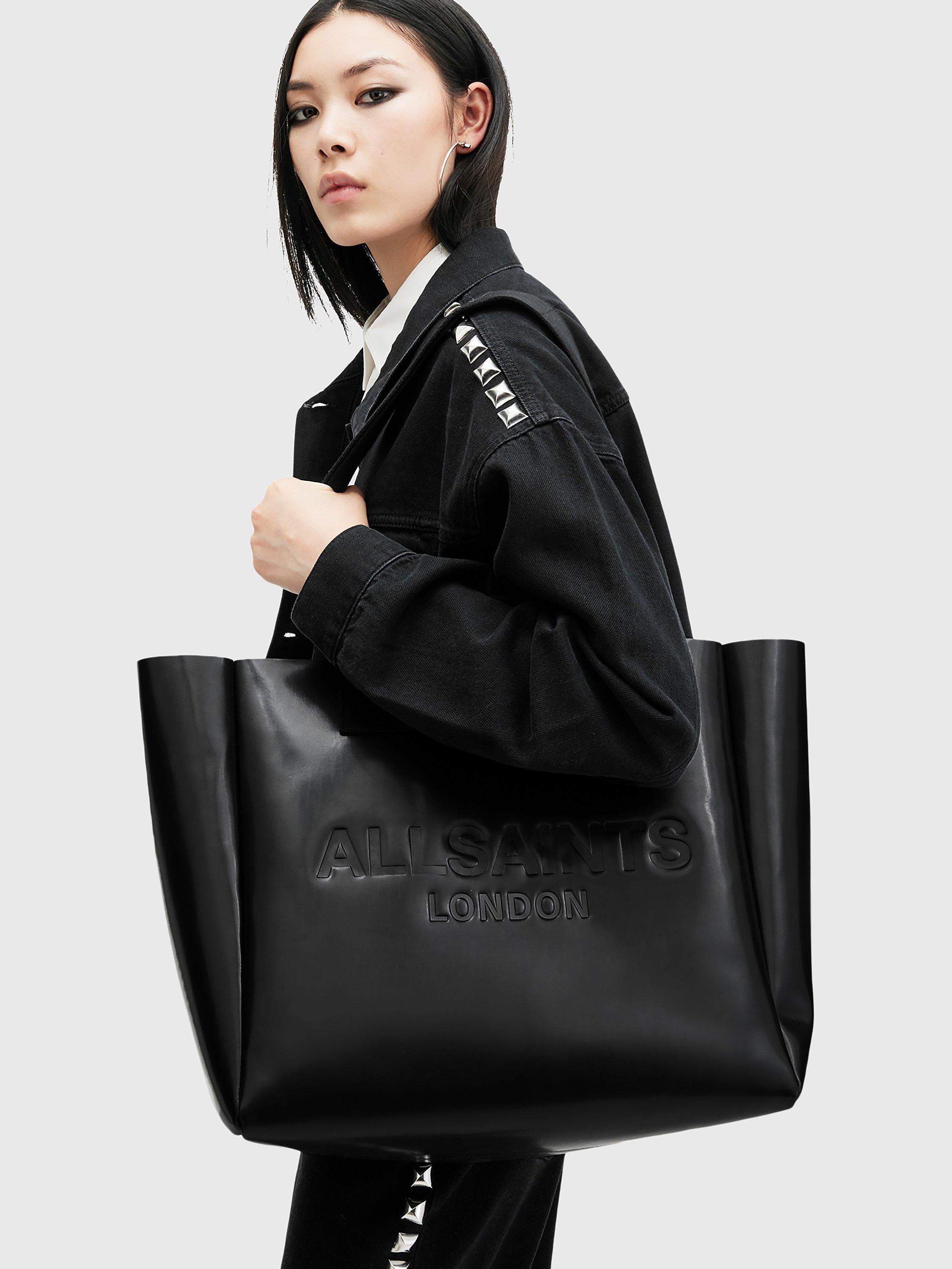 Product image 2 of 7, which shows AllSaints Izzy Leather Tote Bag, Black