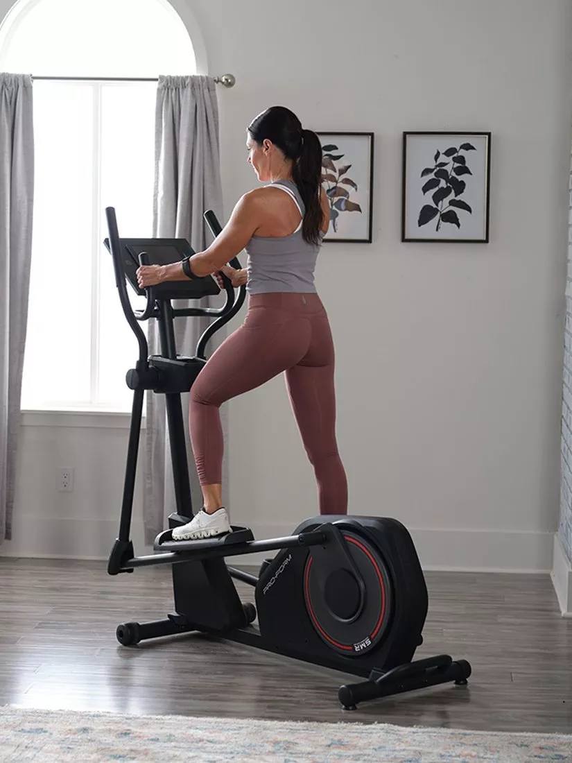 woman on a Proform brand elliptical cross trainer
