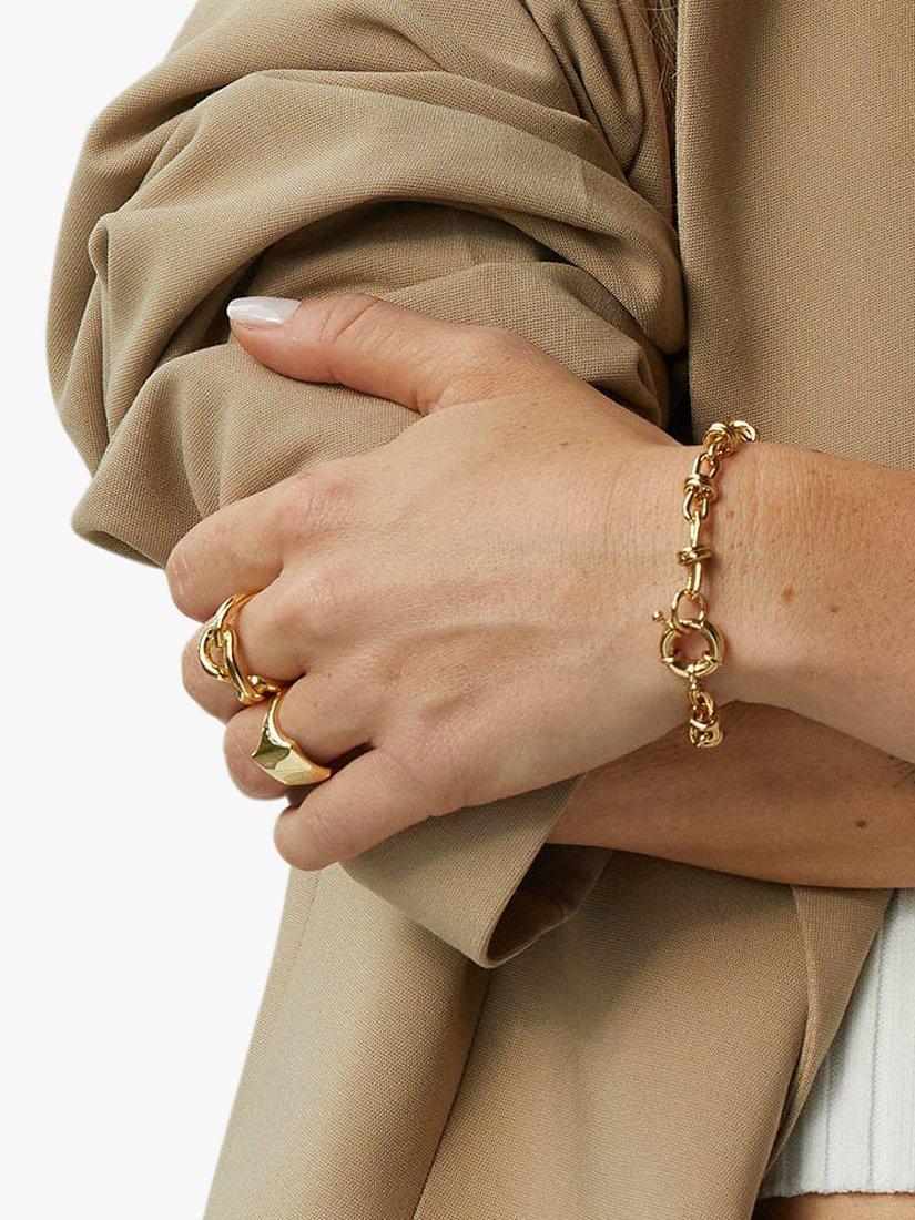 Product image 2 of 3, which shows Daisy London Daisy x Polly Sayer Knot Chain Bracelet, Gold