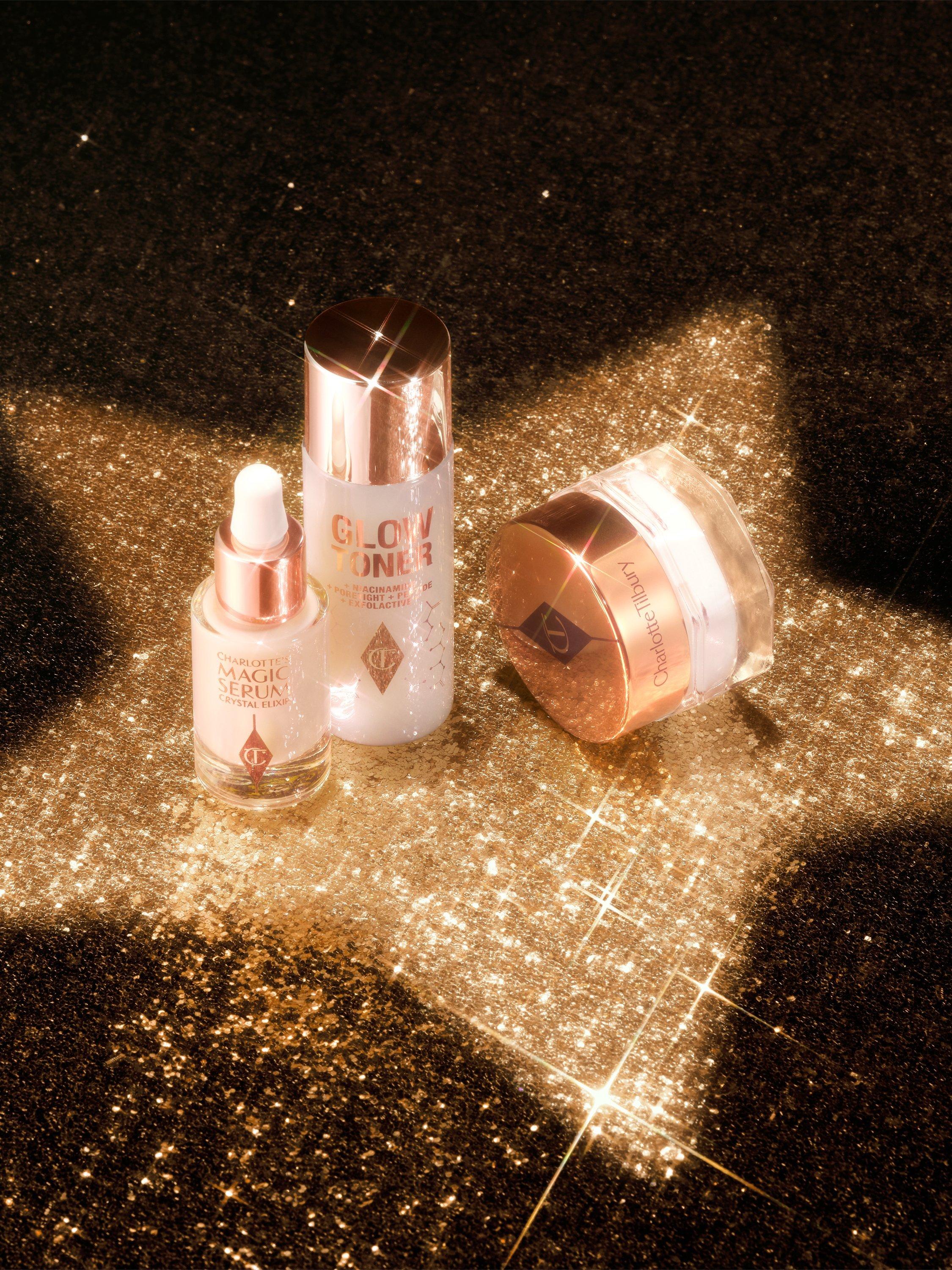 iamge of a charlotte tilbury gift set on a sparkly black background