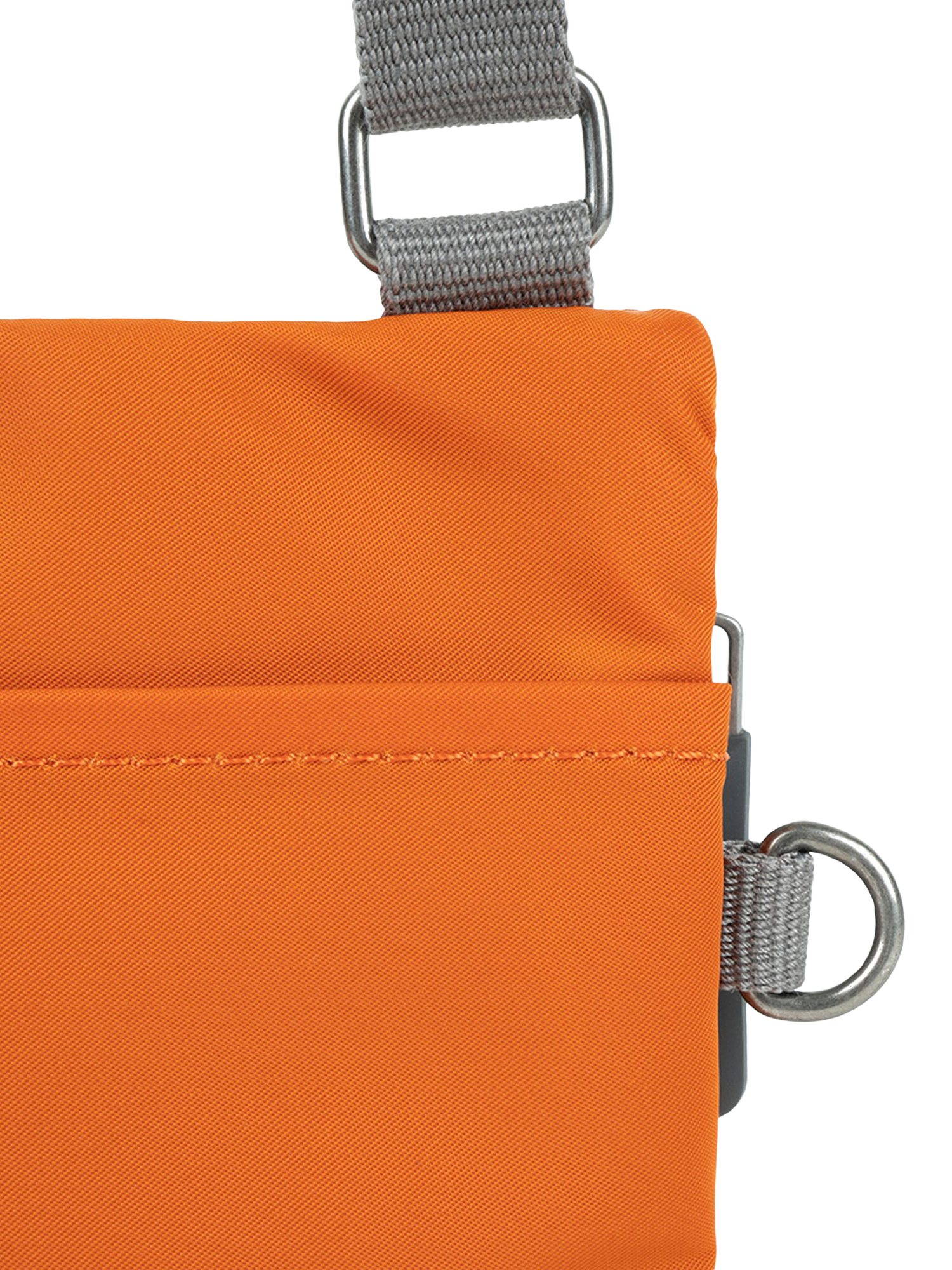 Product image 4 of 6, which shows ROKA London Chelsea Recycled Nylon Crossbody Pocket Bag, Burnt Orange
