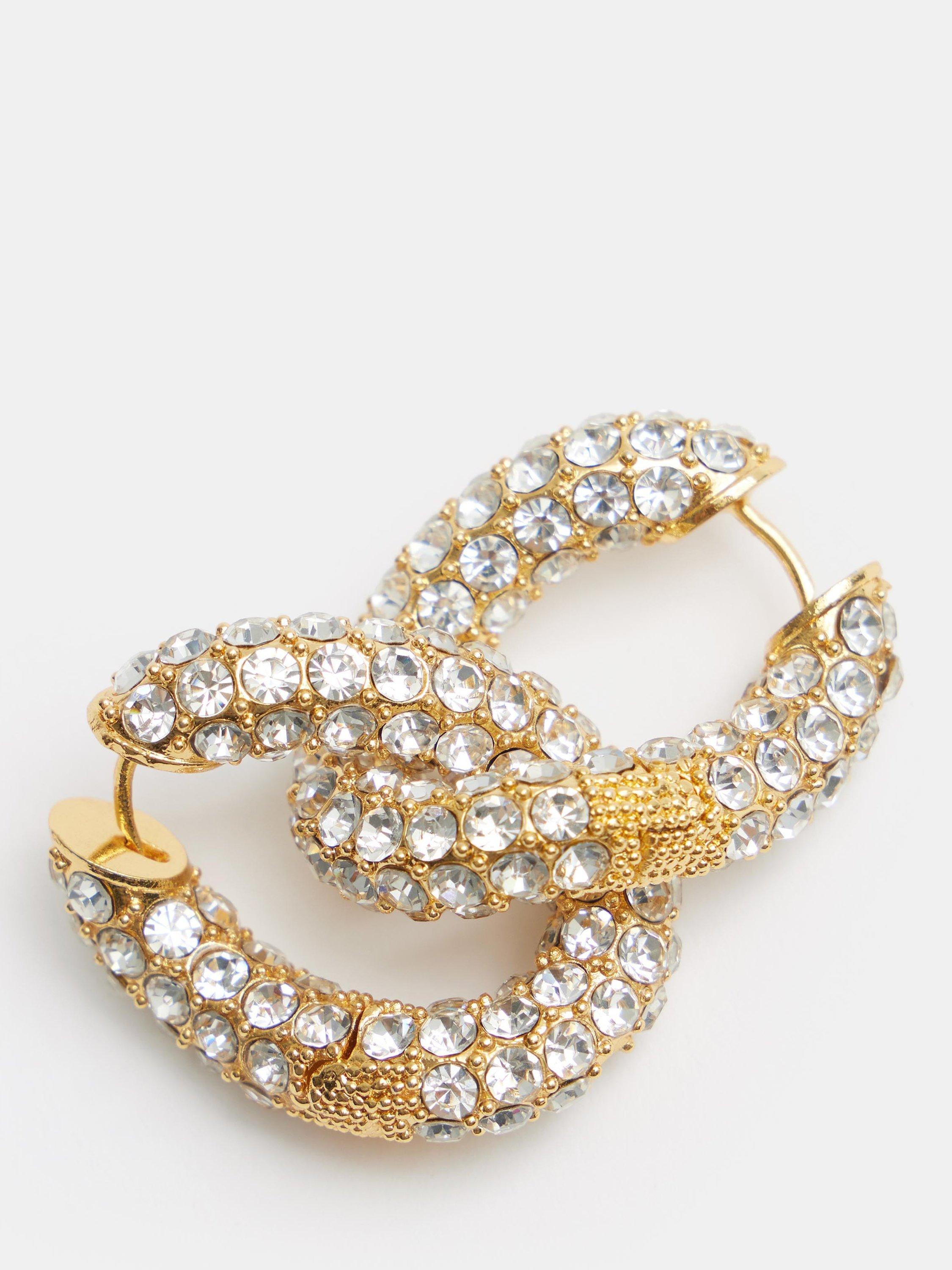 Product image 4 of 4, which shows HUSH Large Pia Crystal Pave Twist Hoop Earrings, Gold