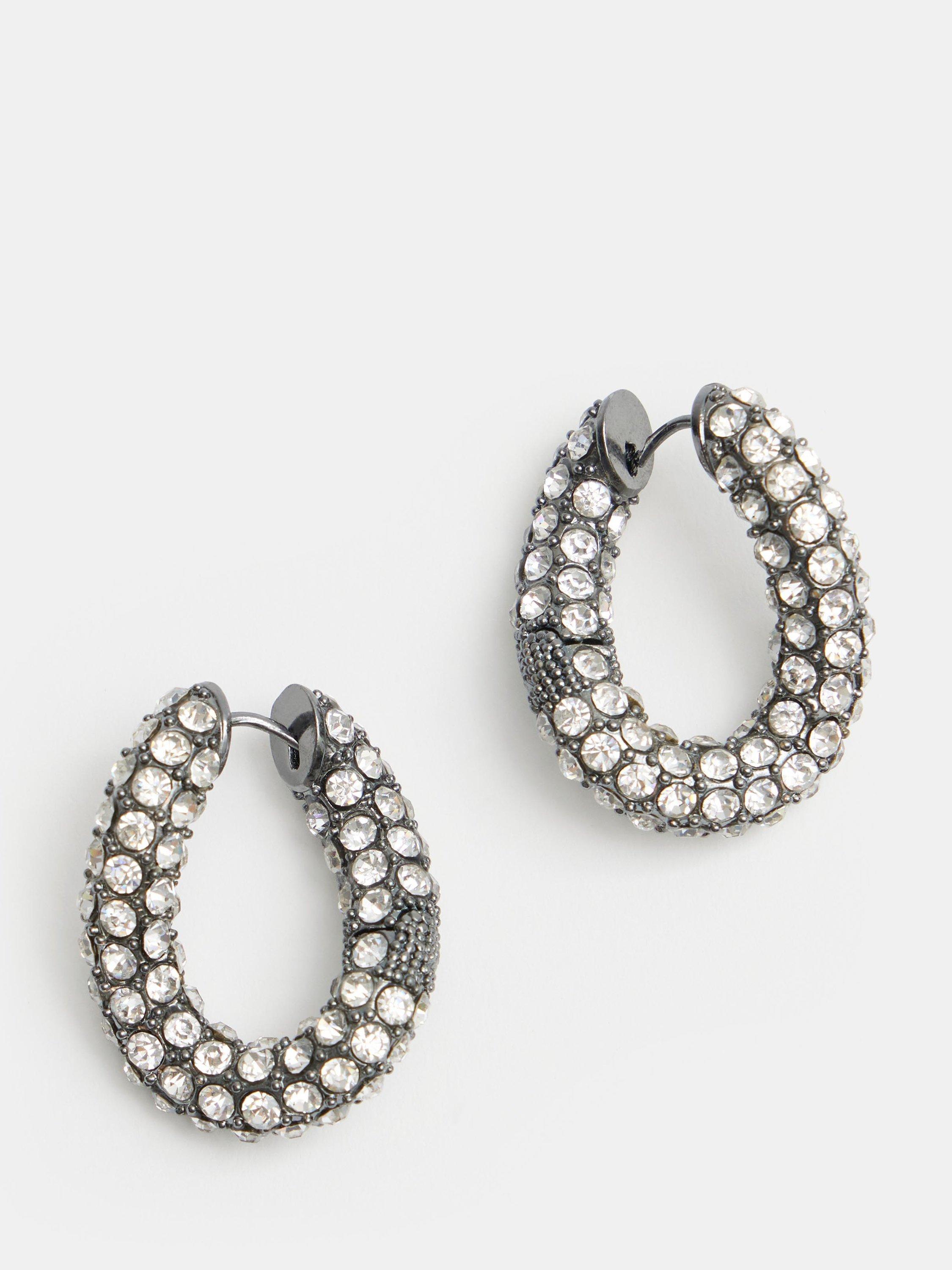 Product image 1 of 6, which shows HUSH Large Pia Crystal Pave Twist Hoop Earrings, Silver