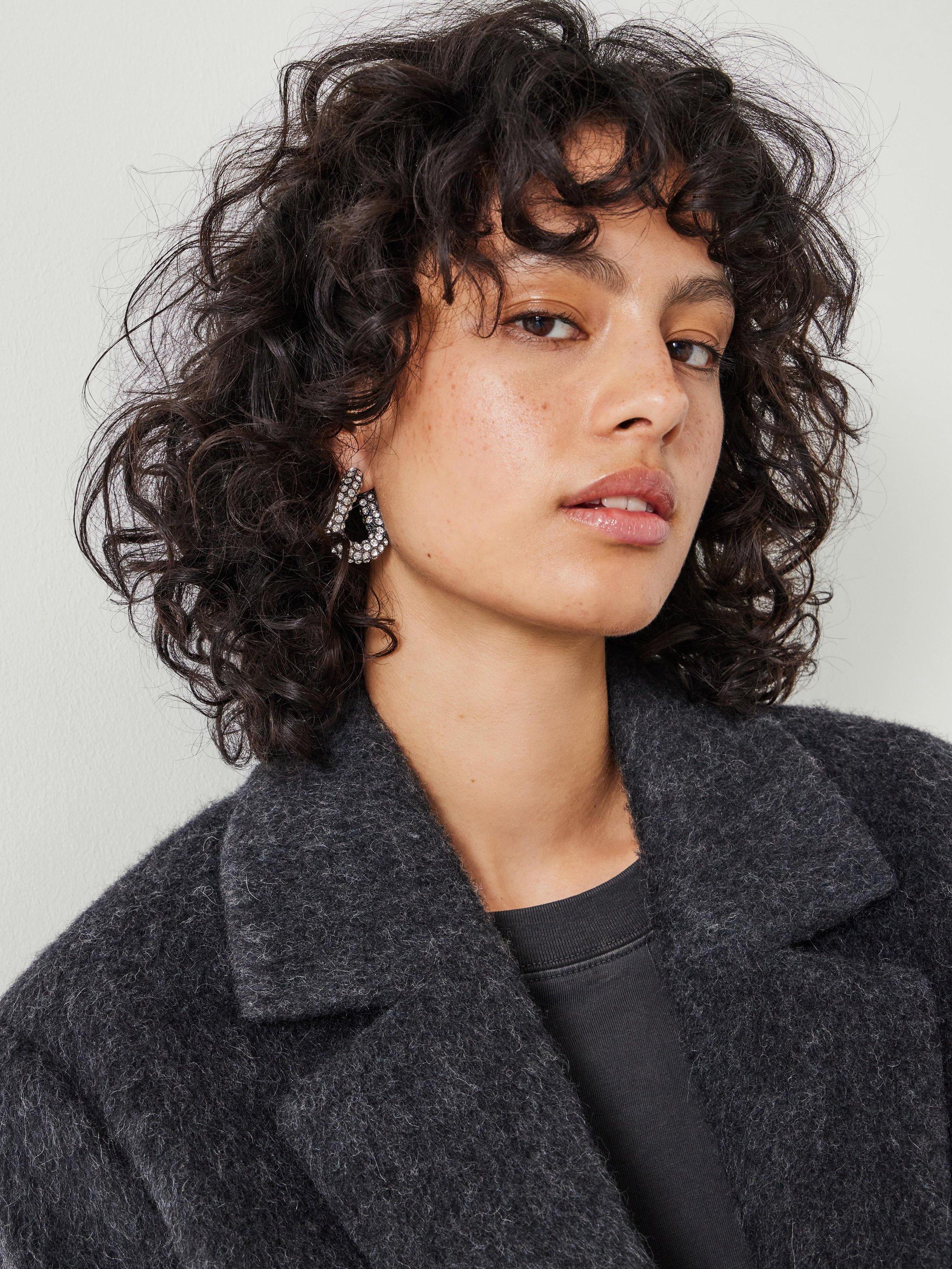 Product image 2 of 6, which shows HUSH Large Pia Crystal Pave Twist Hoop Earrings, Silver