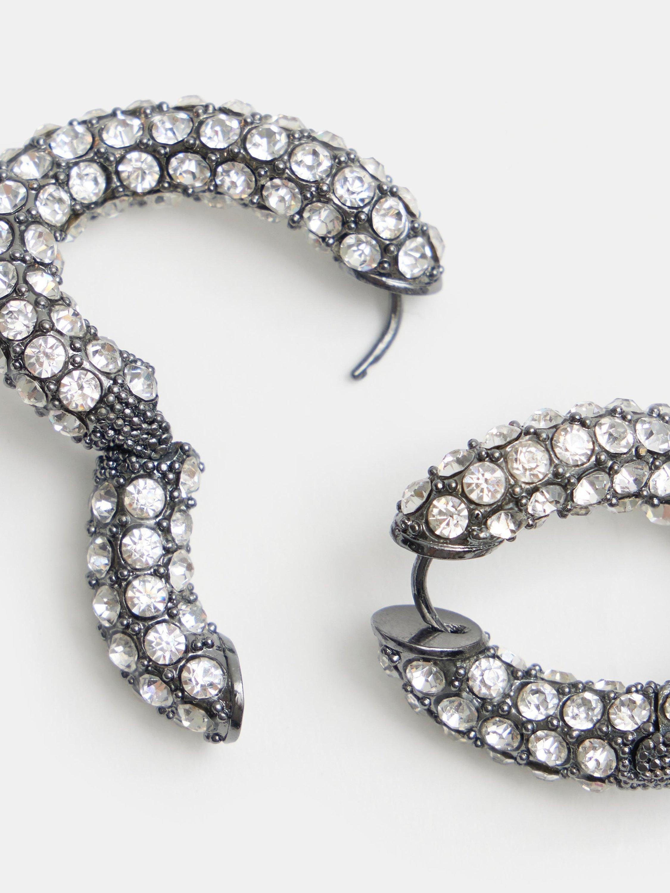 Product image 4 of 6, which shows HUSH Large Pia Crystal Pave Twist Hoop Earrings, Silver