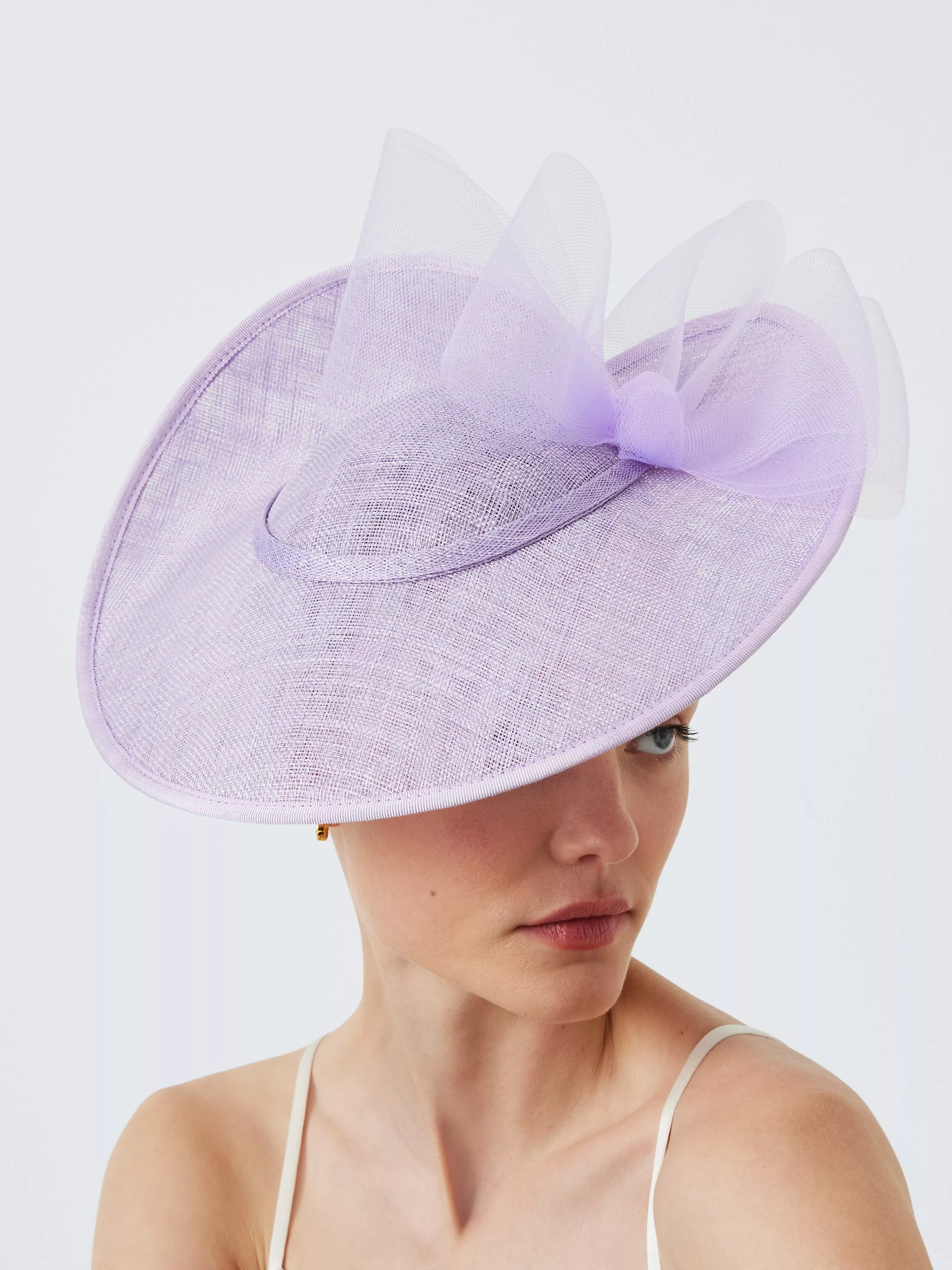 woman in cream occasion hat