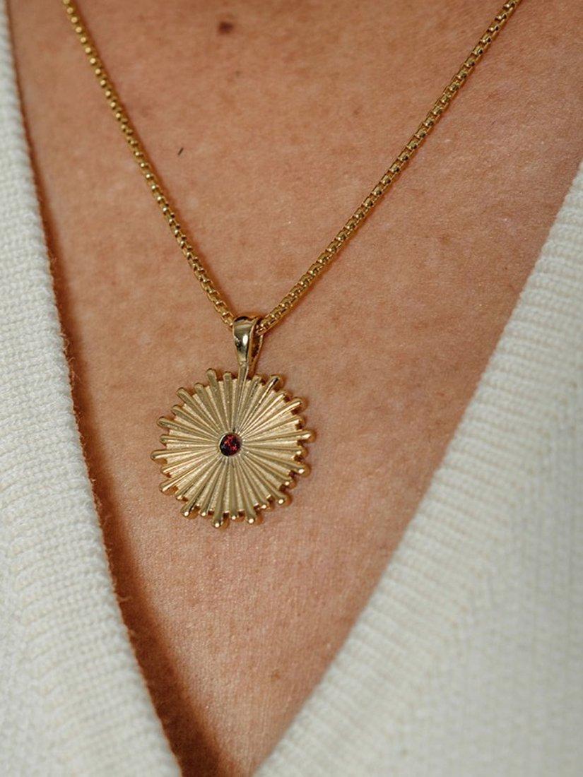 Product image 2 of 6, which shows LARNAUTI x RED January Garnet Sun Pendant Necklace, Gold