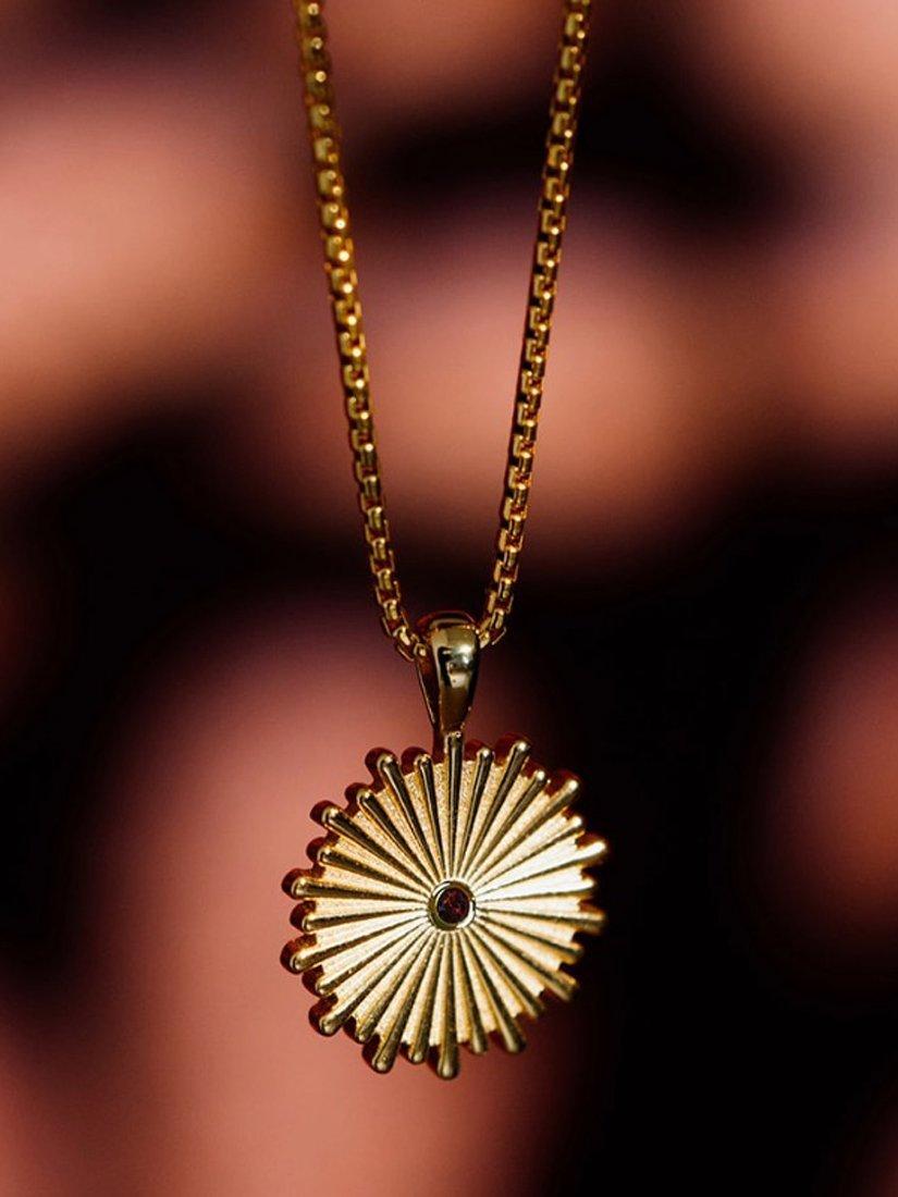 Product image 4 of 6, which shows LARNAUTI x RED January Garnet Sun Pendant Necklace, Gold