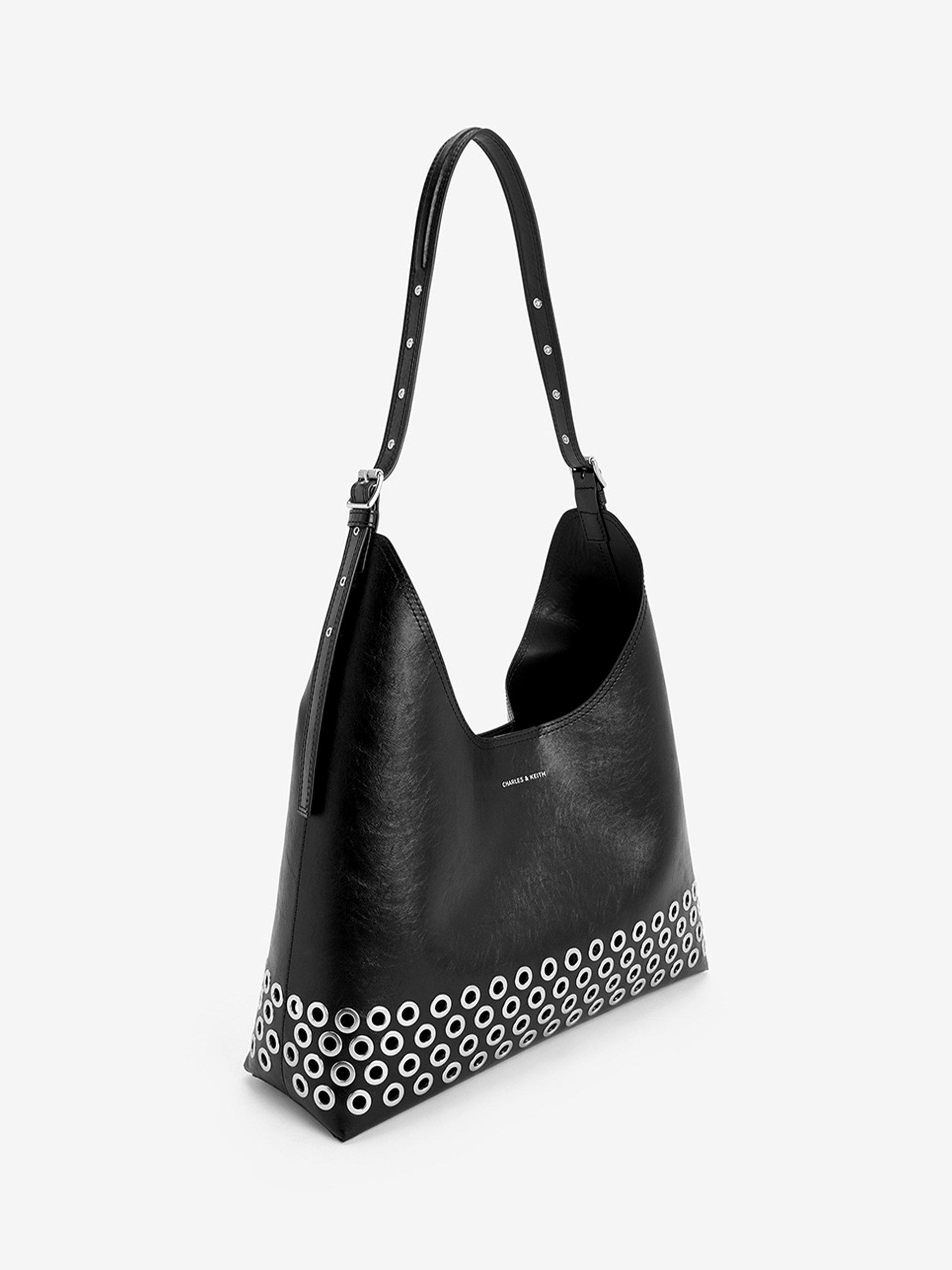 Product image 2 of 5, which shows CHARLES & KEITH Liv Grommet Embellished Hobo Bag, Black