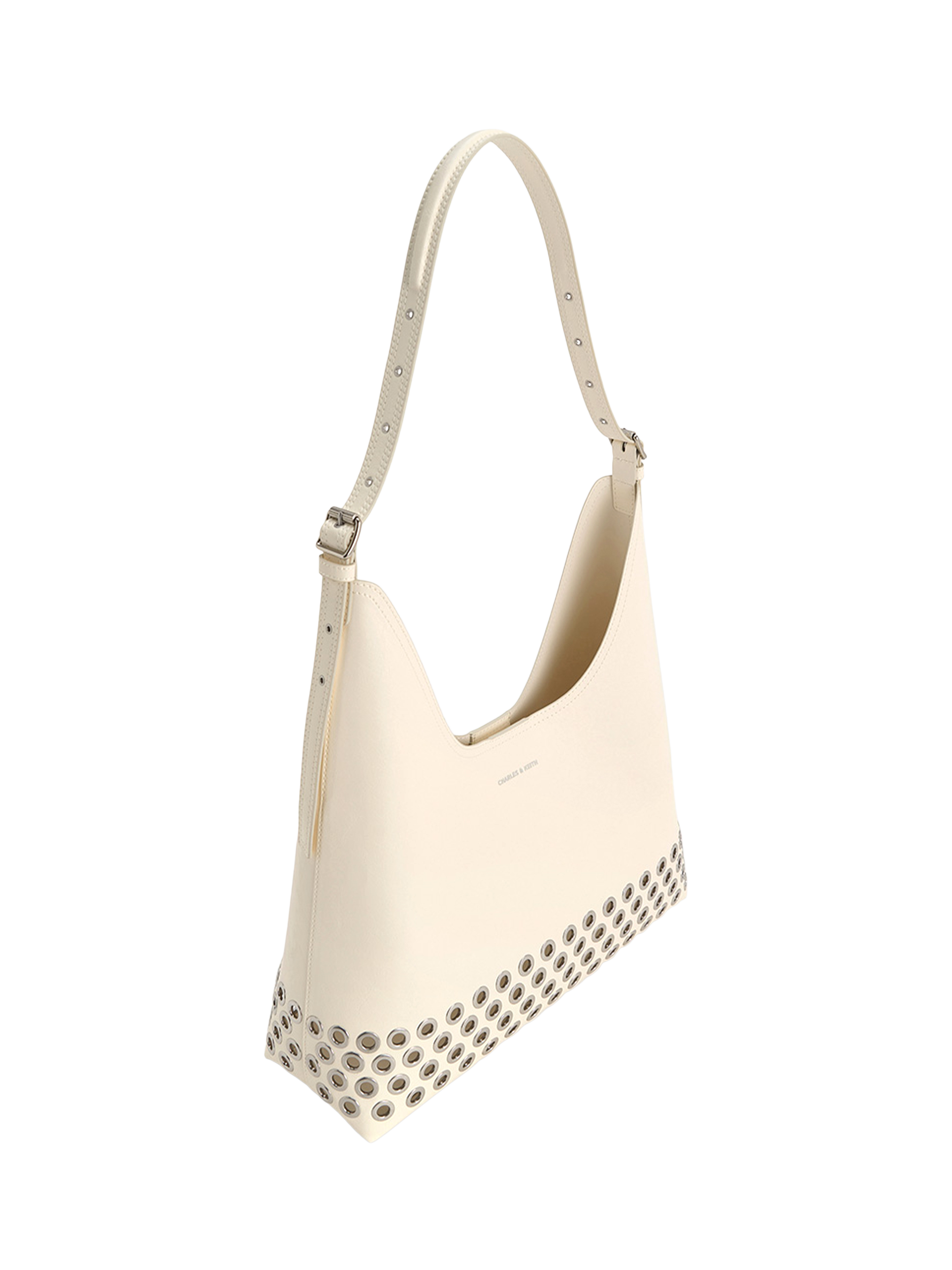 Product image 2 of 4, which shows CHARLES & KEITH Liv Grommet Embellished Hobo Bag, Cream
