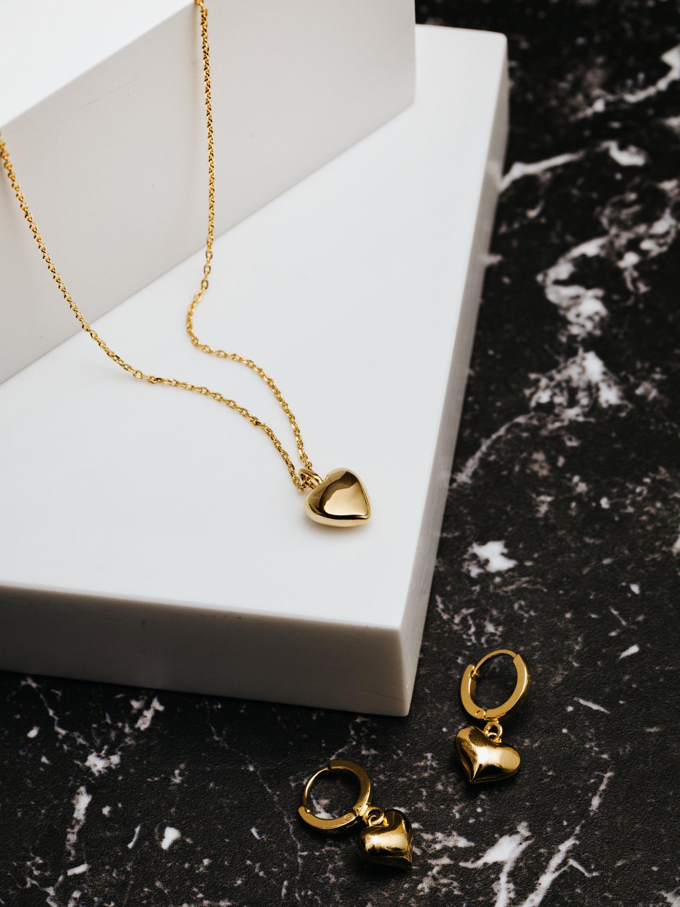 Product image 3 of 3, which shows Orelia Huggie Heart Hoop Earrings, Gold