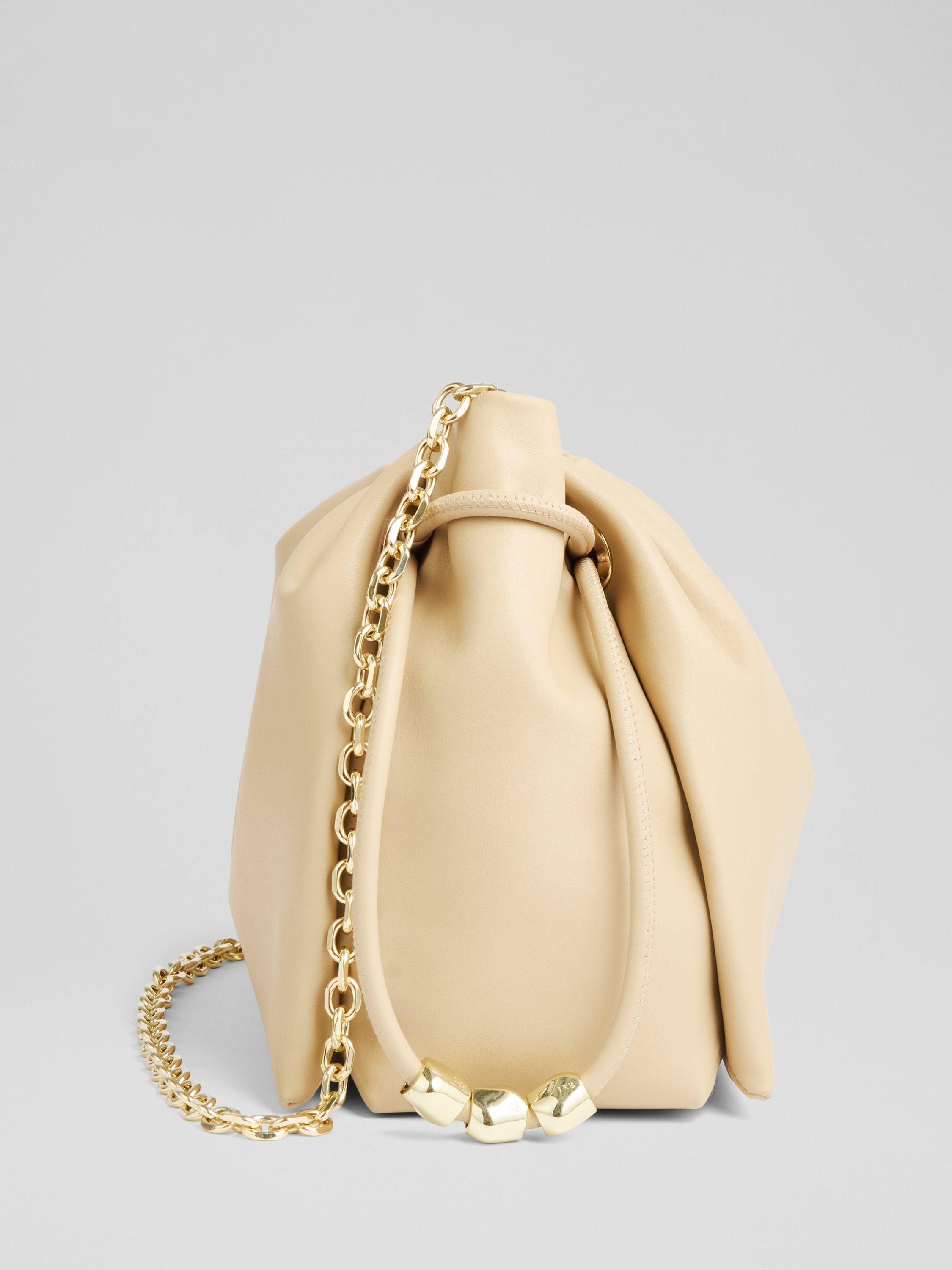 Product image 2 of 3, which shows L.K.Bennett Kendra Beaded Drawstring Leather Crossbody Bag, Light Taupe