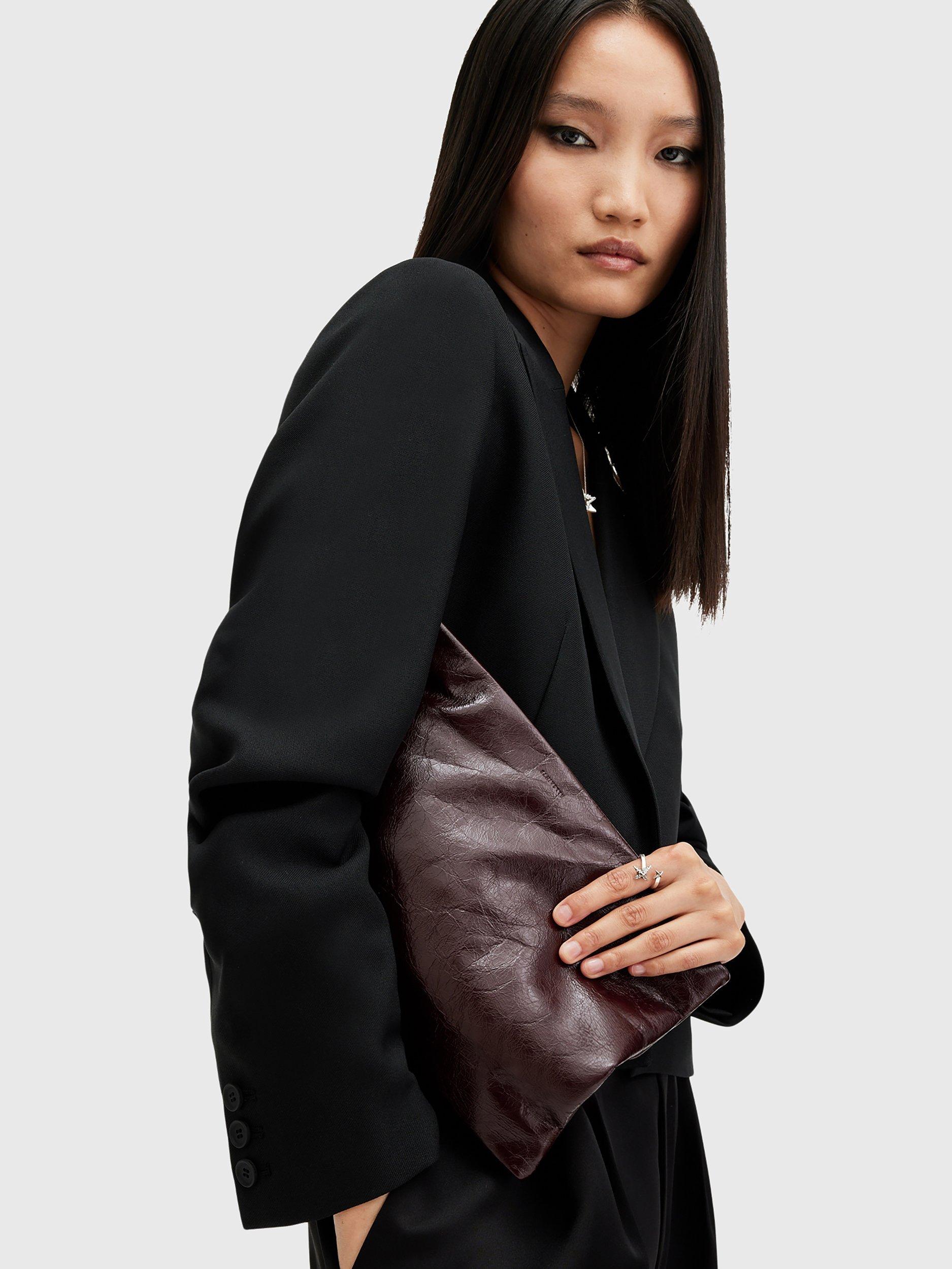 Product image 2 of 6, which shows AllSaints Bettina Leather Clutch Bag, Dark Red
