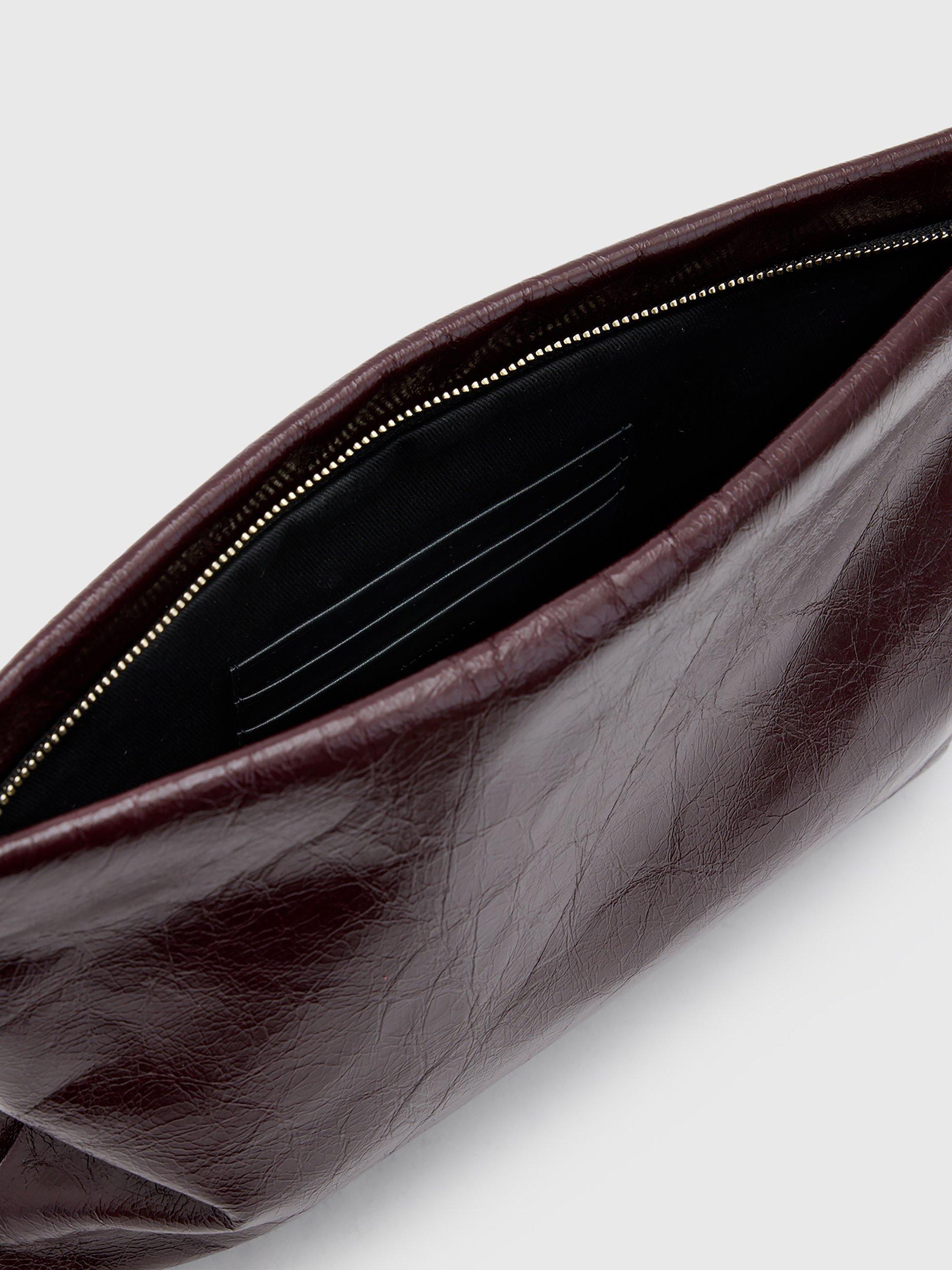 Product image 3 of 6, which shows AllSaints Bettina Leather Clutch Bag, Dark Red