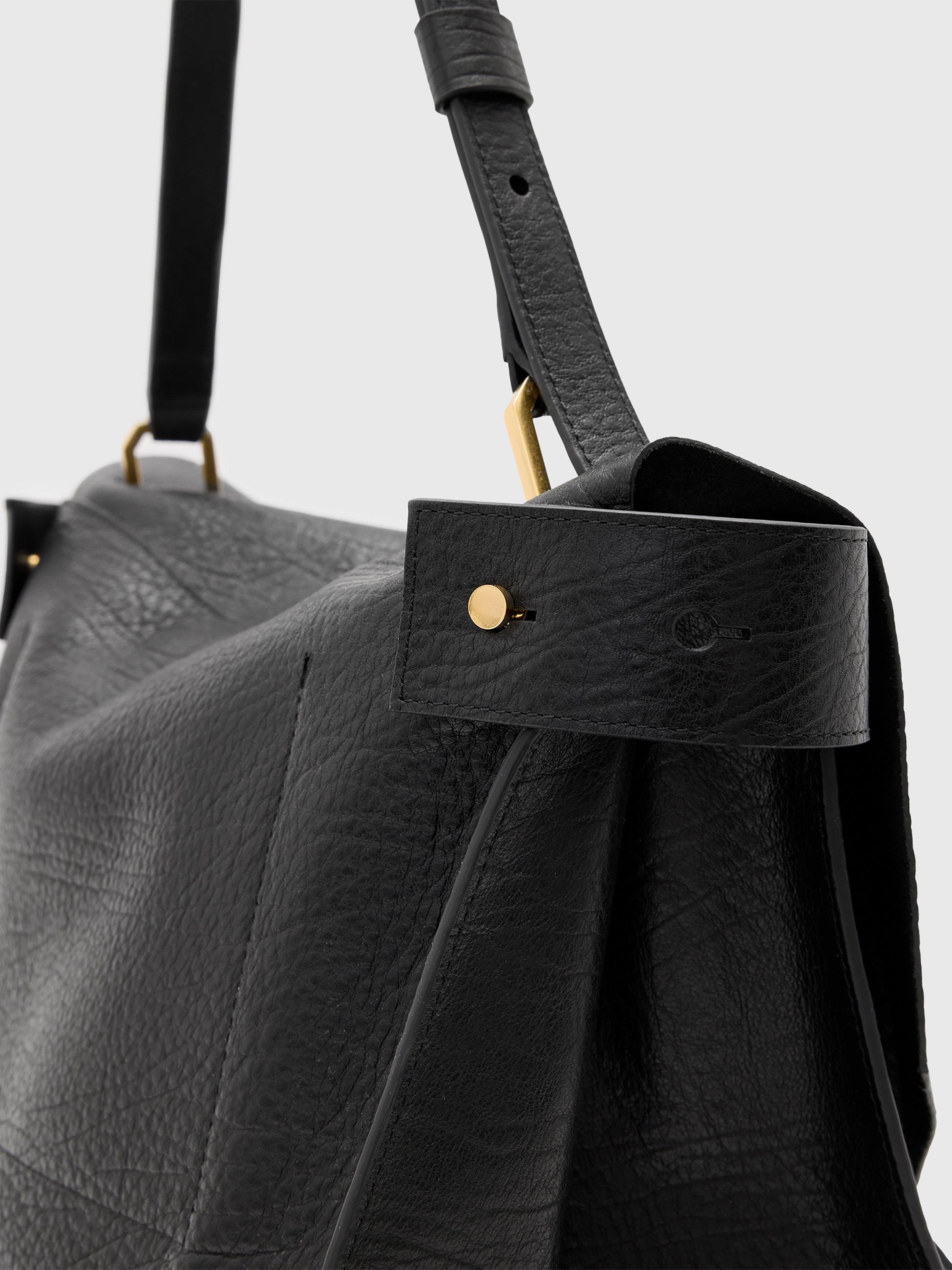 Product image 8 of 9, which shows AllSaints Ursa Grain Leather Satchel Bag, Black Black