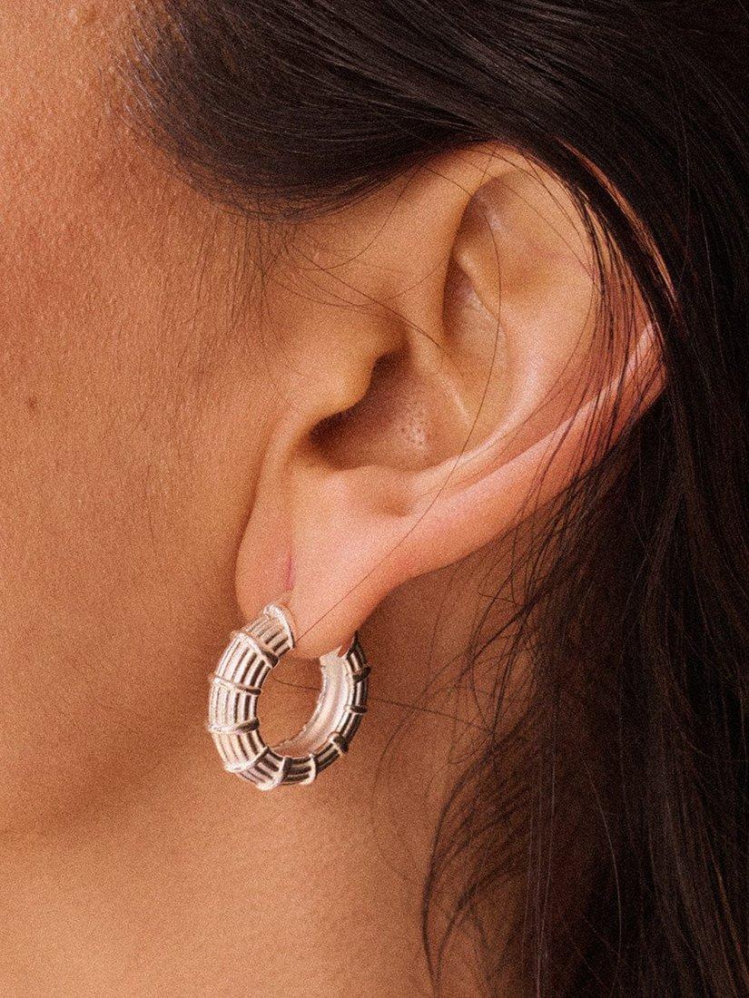 Product image 4 of 5, which shows Daisy London Apollo Textured Hoop Earrings, Silver