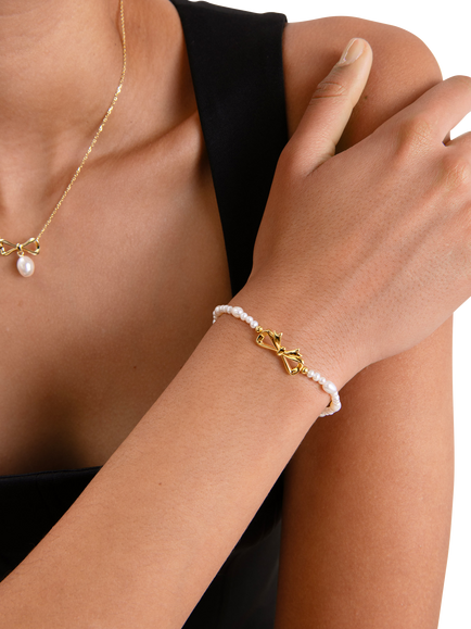 Edge of Ember Bow Pearl Bracelet, Gold - view 2, Yellow Gold