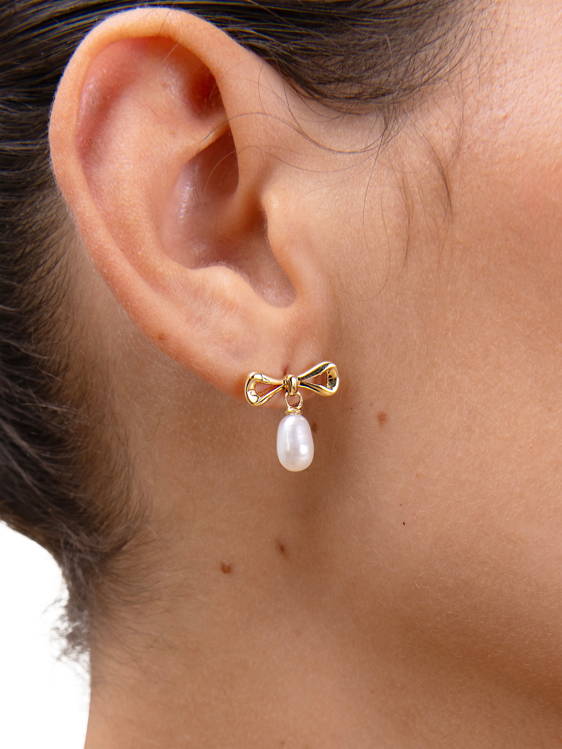 Product image 5 of 6, which shows Edge of Ember Bow Pearl Stud Drop Earrings, Gold