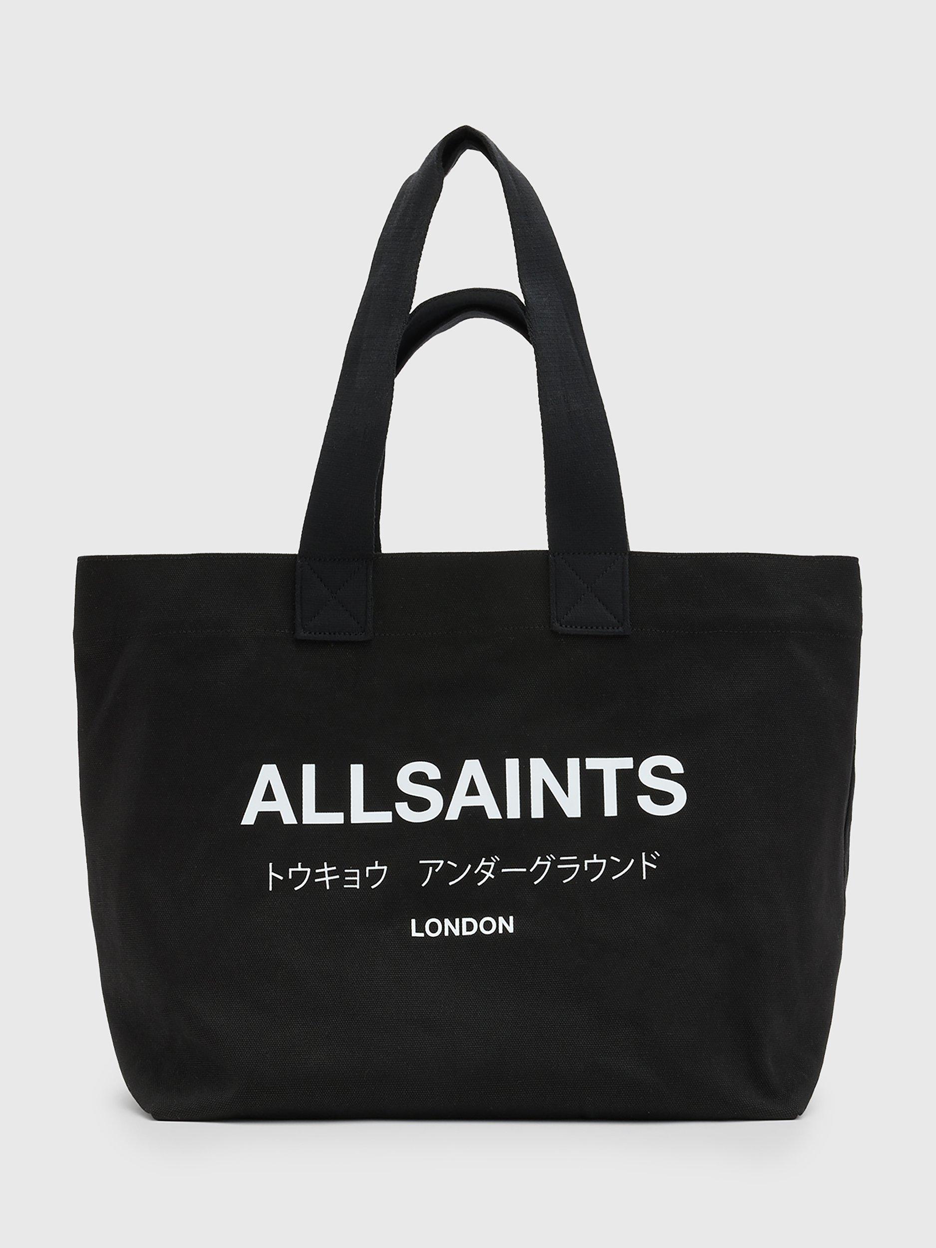 Product image 1 of 7, which shows AllSaints Ali Canvas East/West Tote Bag, Black