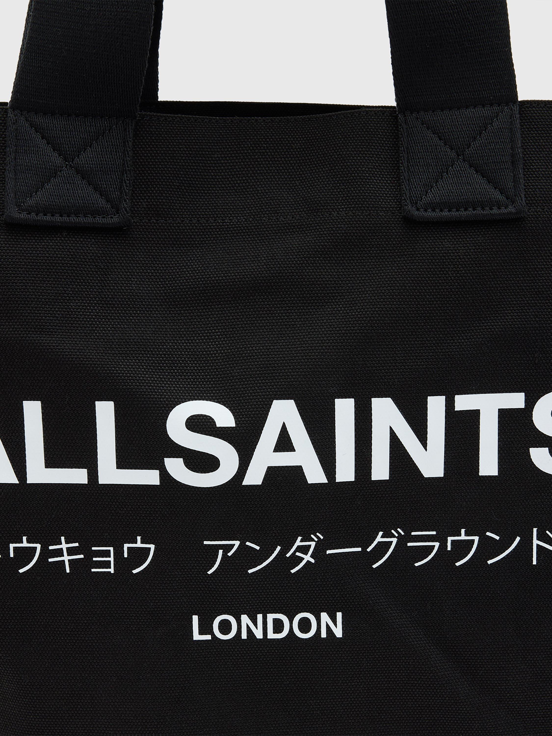Product image 6 of 7, which shows AllSaints Ali Canvas East/West Tote Bag, Black