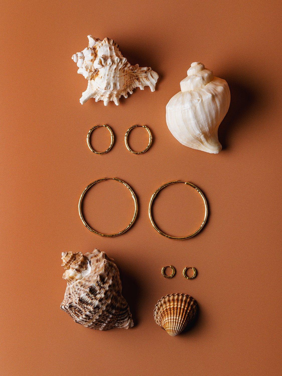 Product image 4 of 4, which shows Orelia Polished Molten Large Hoop Earrings, Gold