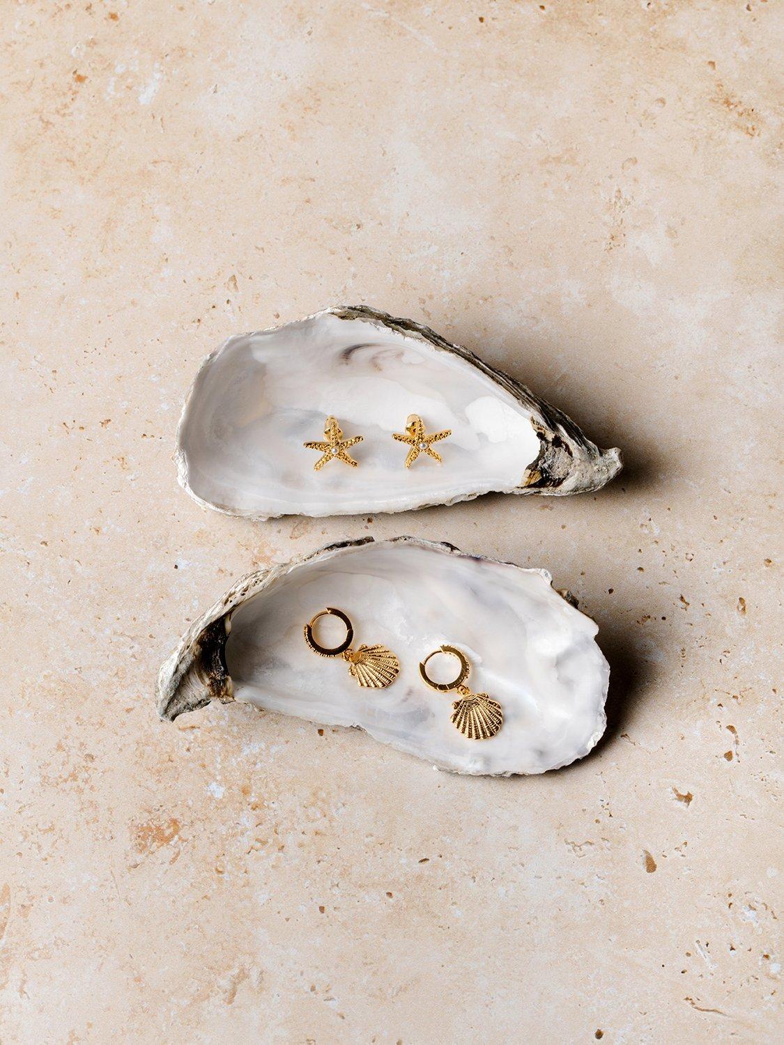 Product image 3 of 3, which shows Orelia Starfish and Pearl Stud Earrings, Gold